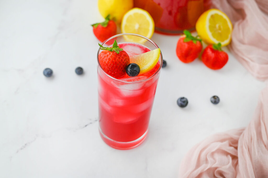 a glass with a fruit mixture to drink on hot days.