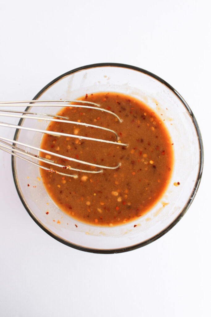 a small glass bowl with homemade sauce mixed inside.