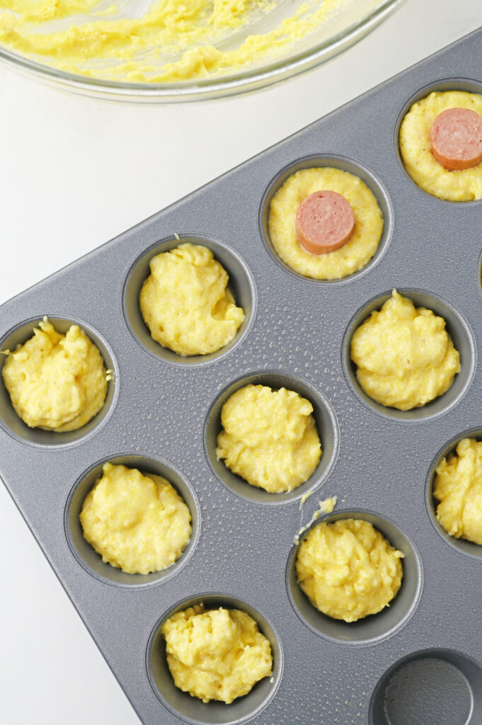 prepared batter in a muffin tin.