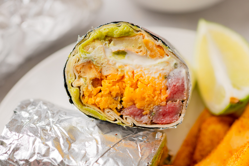 a San Diego classic meal served with fries on a plate.
