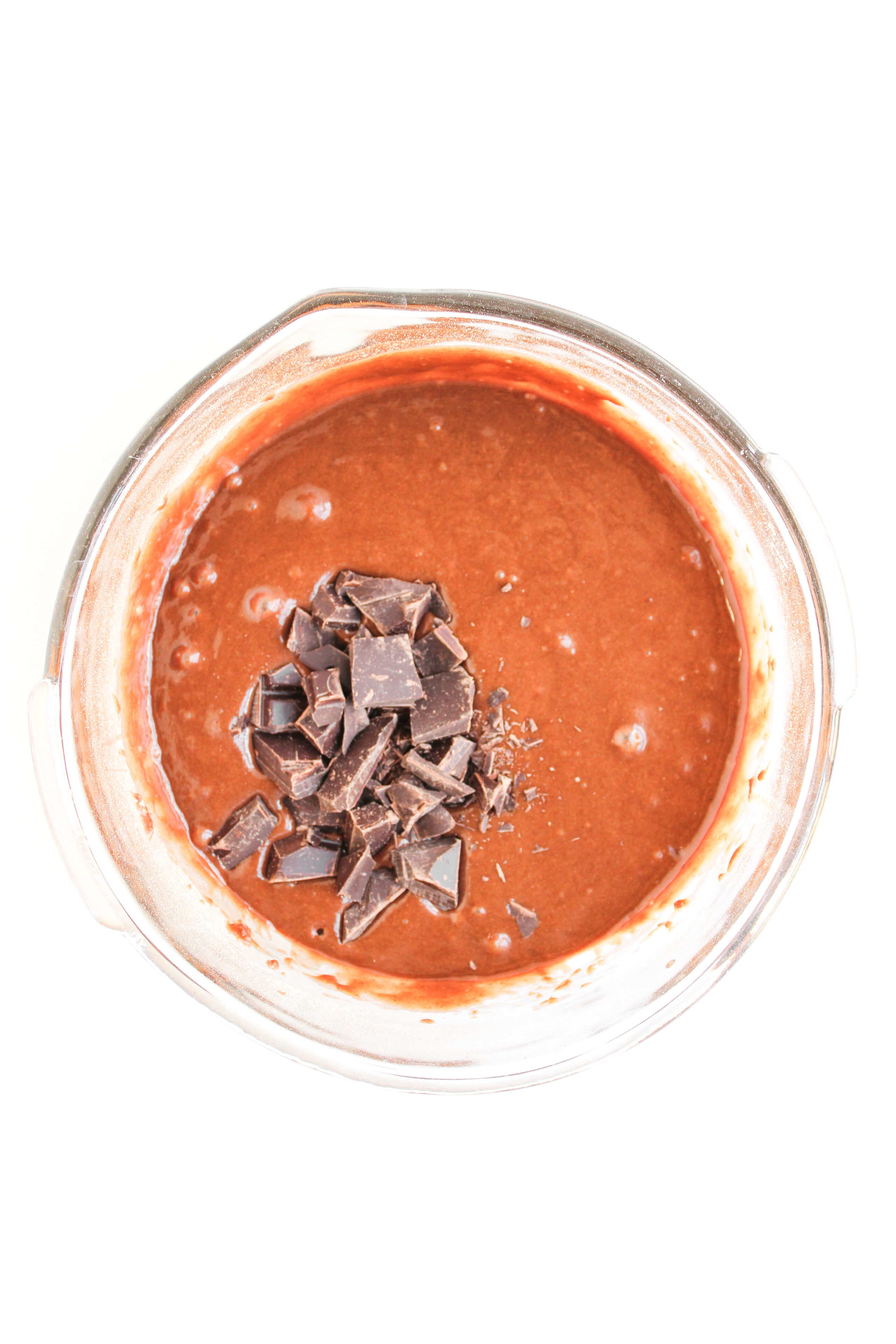 prepared brownie mix with chocolate pieces added into the batter.