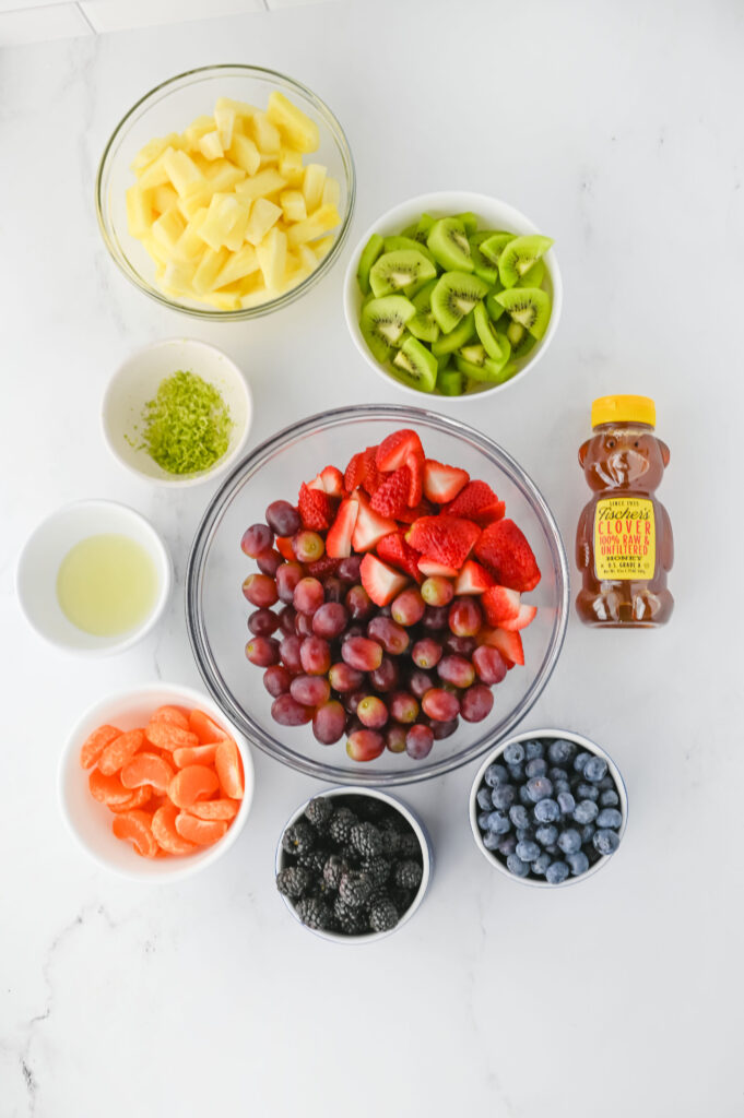 all the ingredients needed to make Fruit Salad.