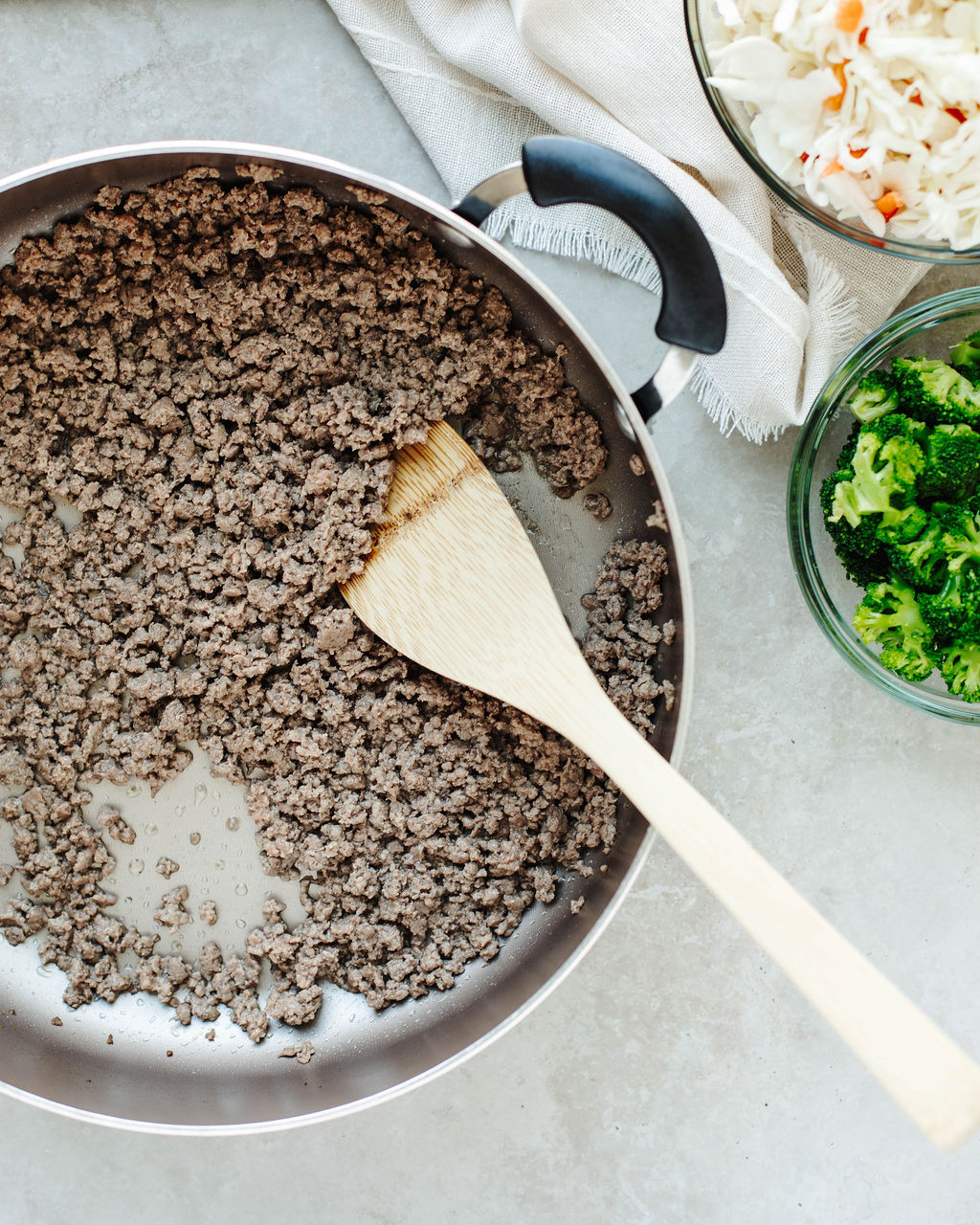 Ground beef cooking in skillet for egg roll in a bowl recipe