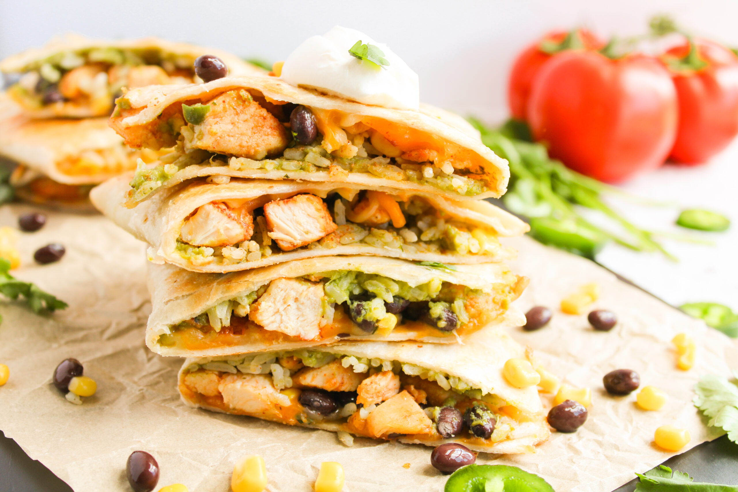 a Tex mex meal or appetizer served with fresh tomatoes and corn.