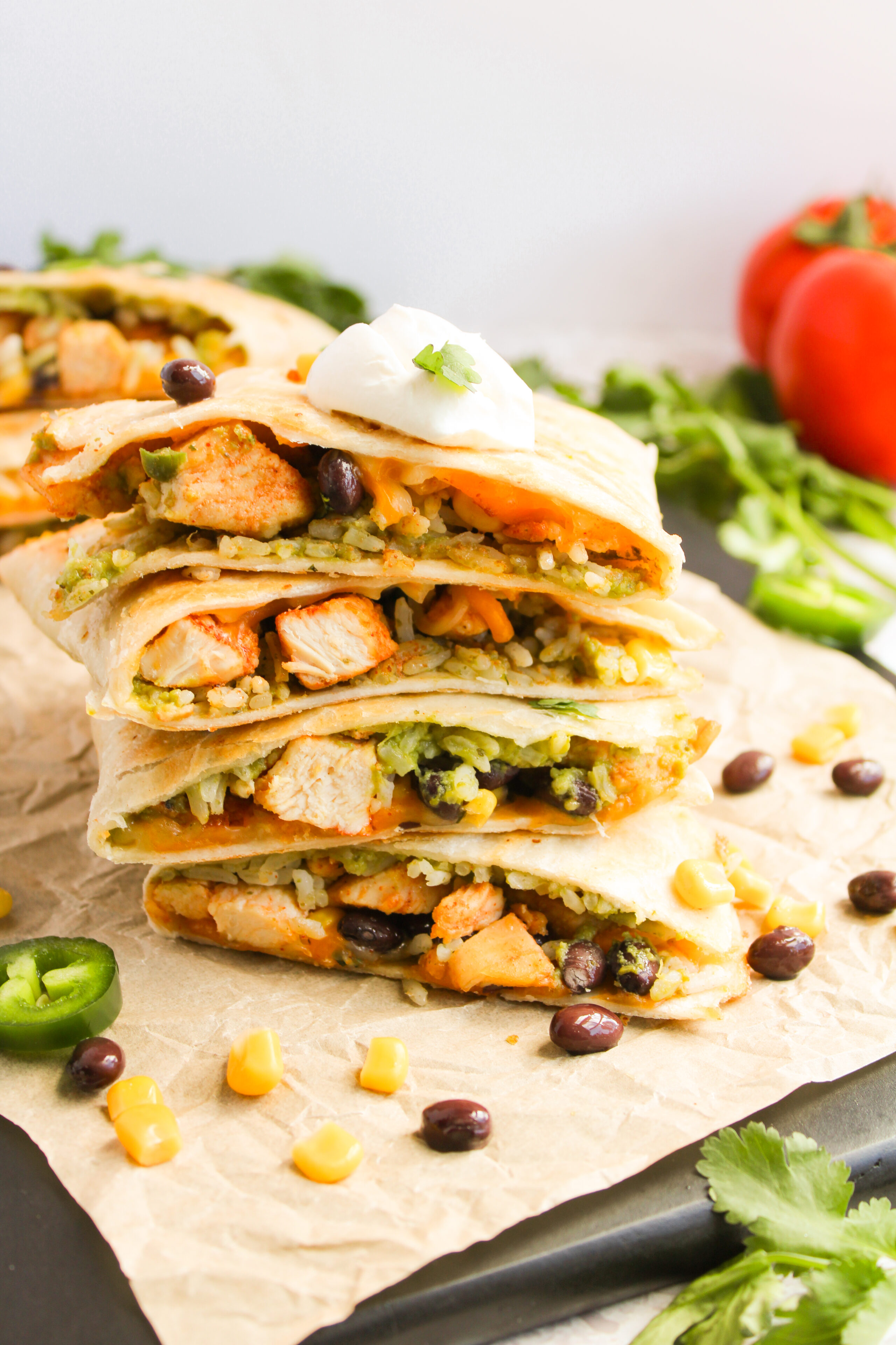 stacked southwestern chicken quesadillas on a cutting board.