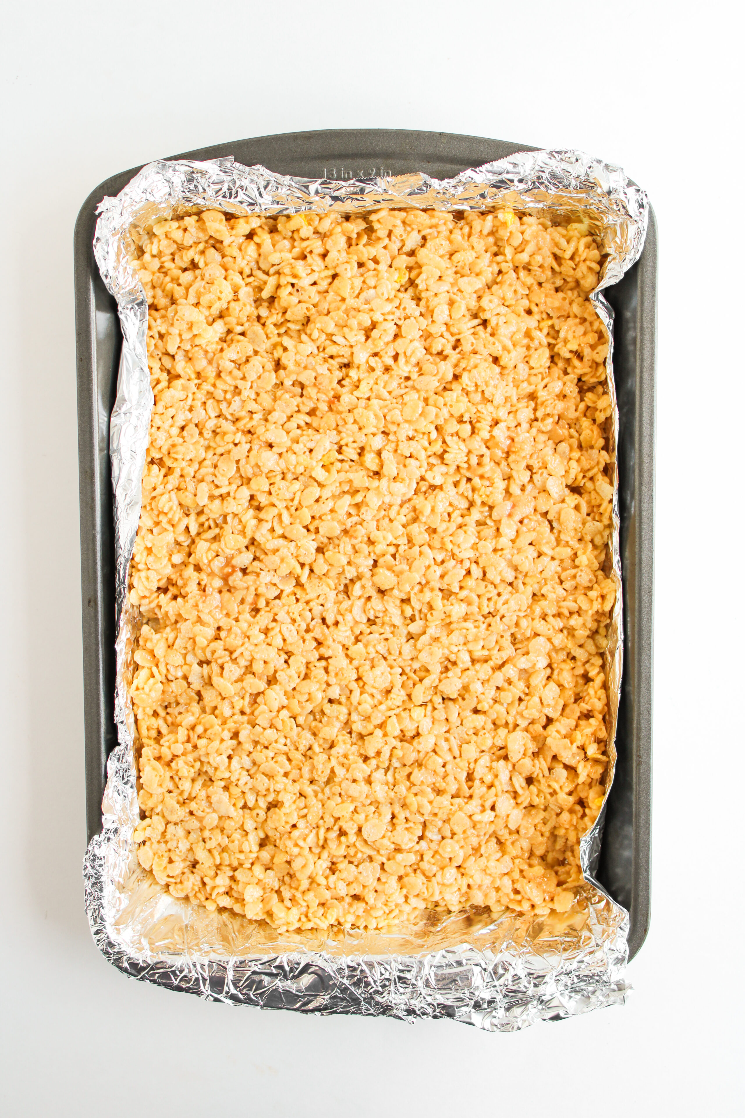 rice krispie mixture pressed into a 9x13 baking pan.