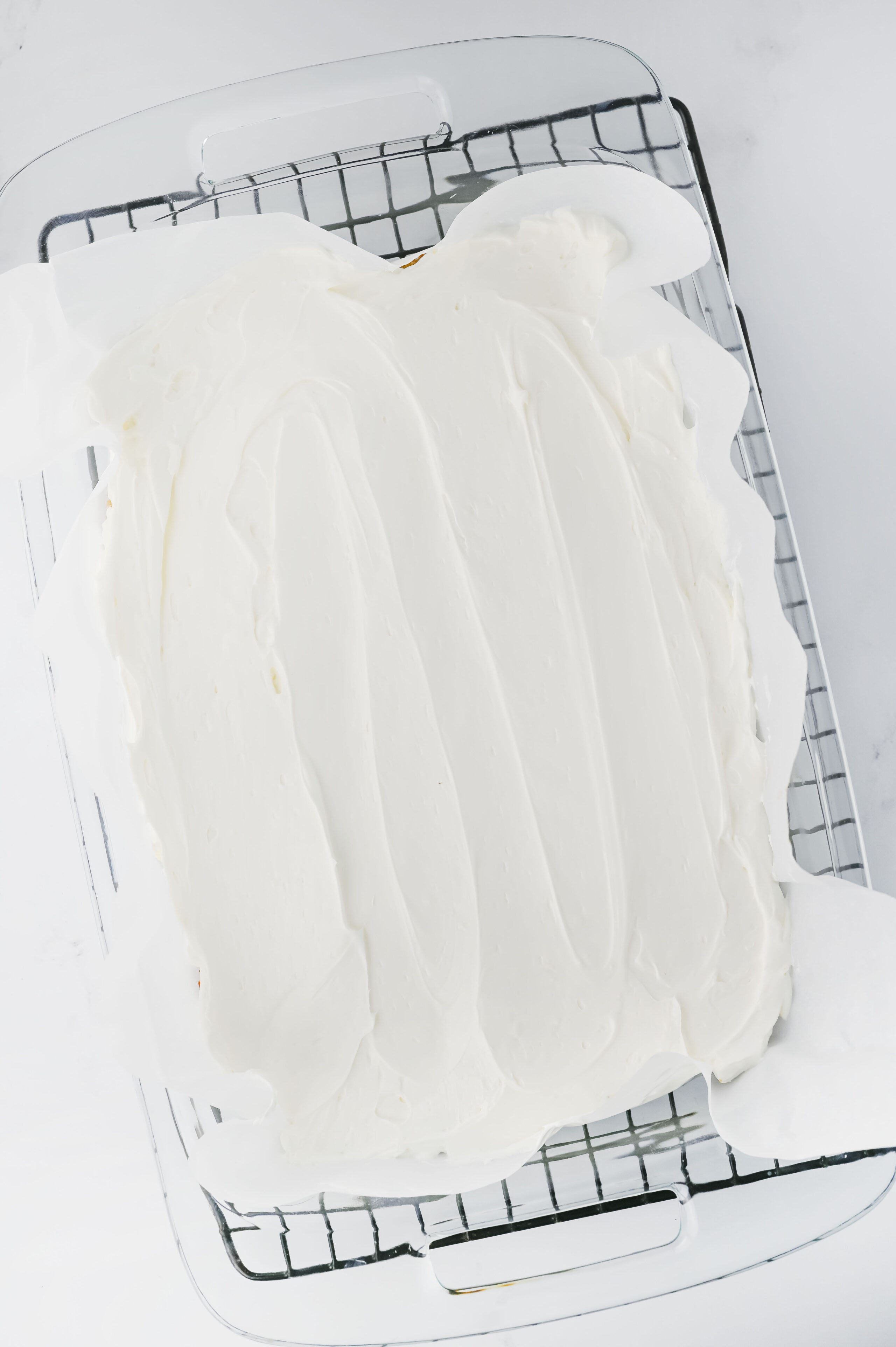 cream cheese mixture spread over pretzel crust to layer into a lemon pretzel dessert.