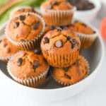 Easy pumpkin muffins with chocolate chips served in a white bowl.