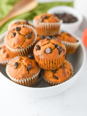 Easy pumpkin muffins with chocolate chips served in a white bowl.