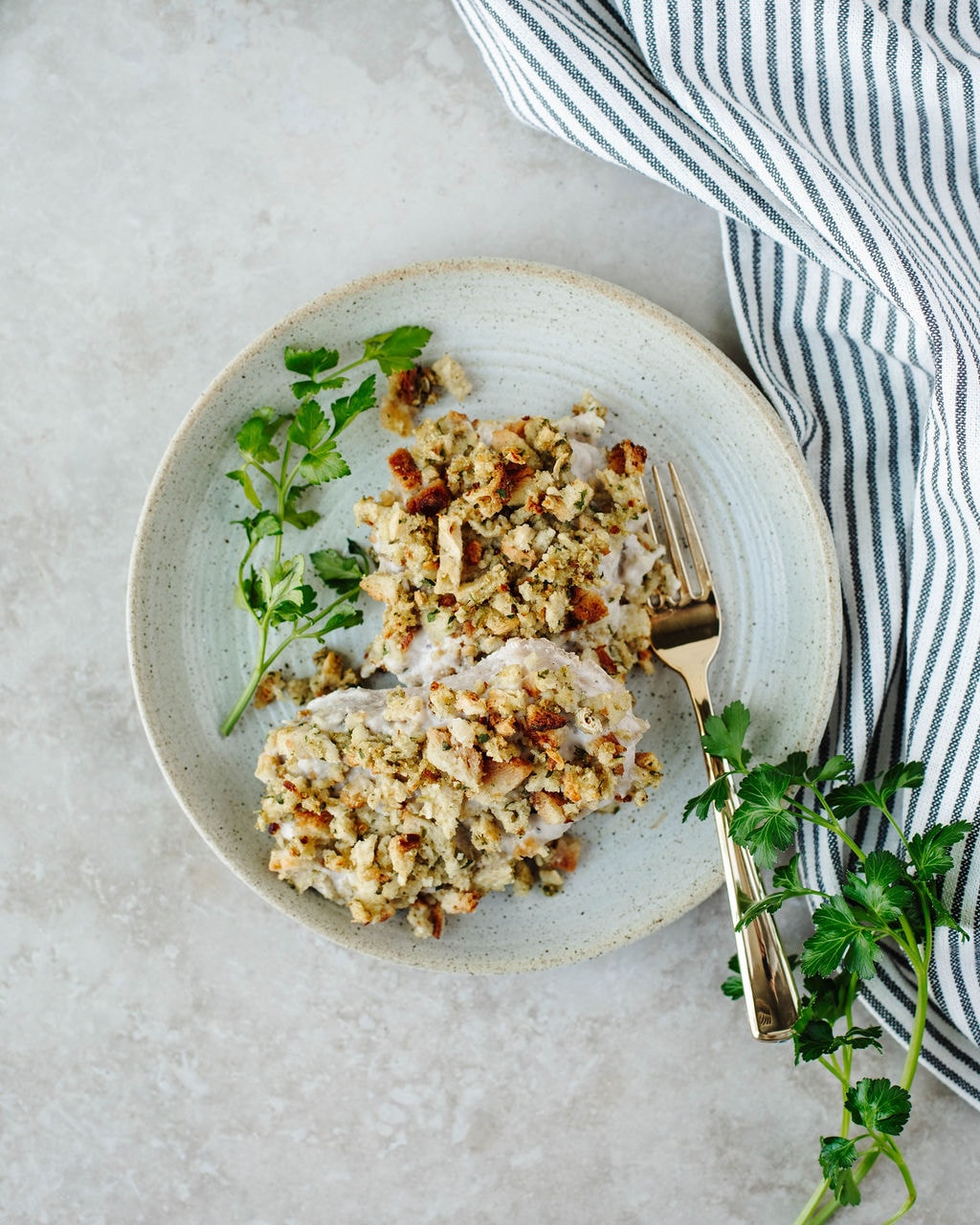 Juicy pork chops topped with stovetop stuffing ready to serve.
