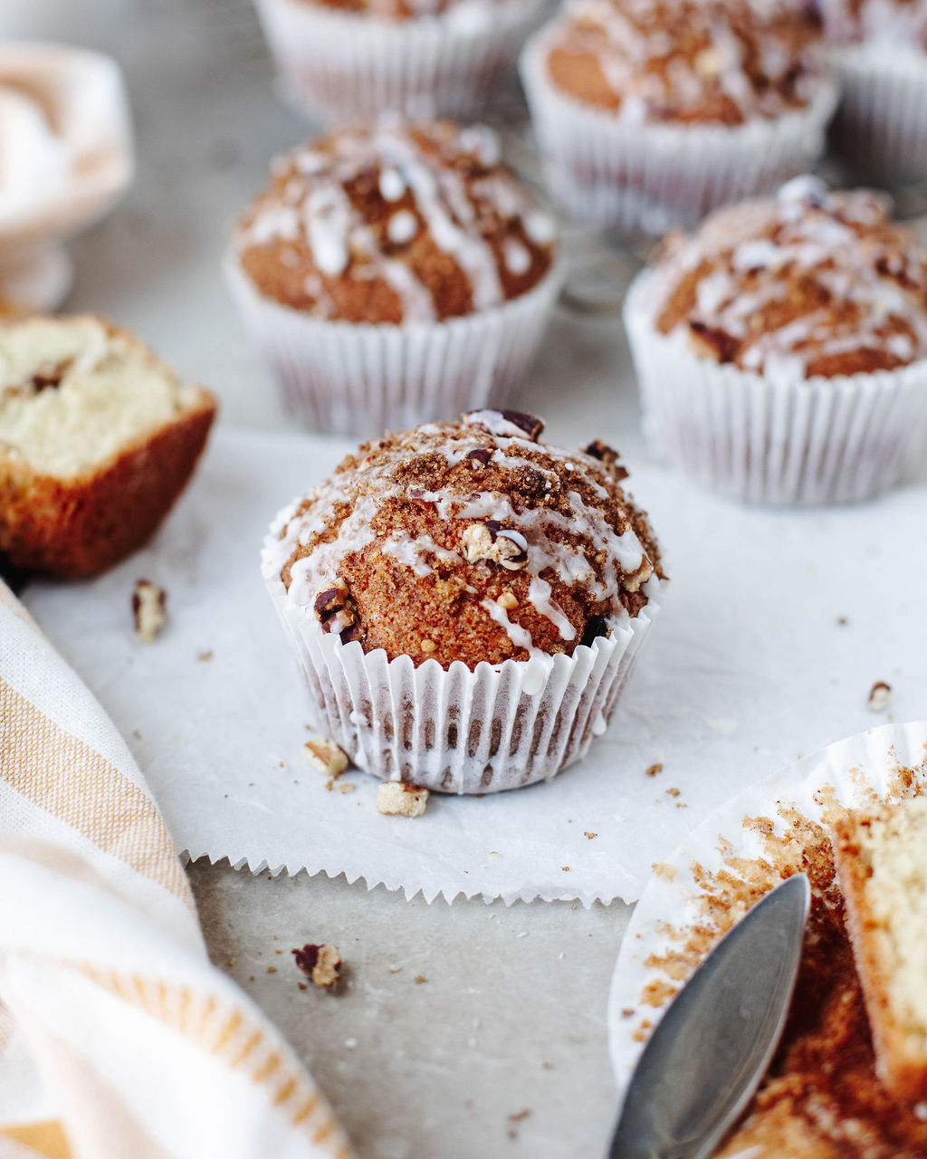 Soft and fluffy coffee cake muffin topped with crunchy streusel and powdered sugar glaze.