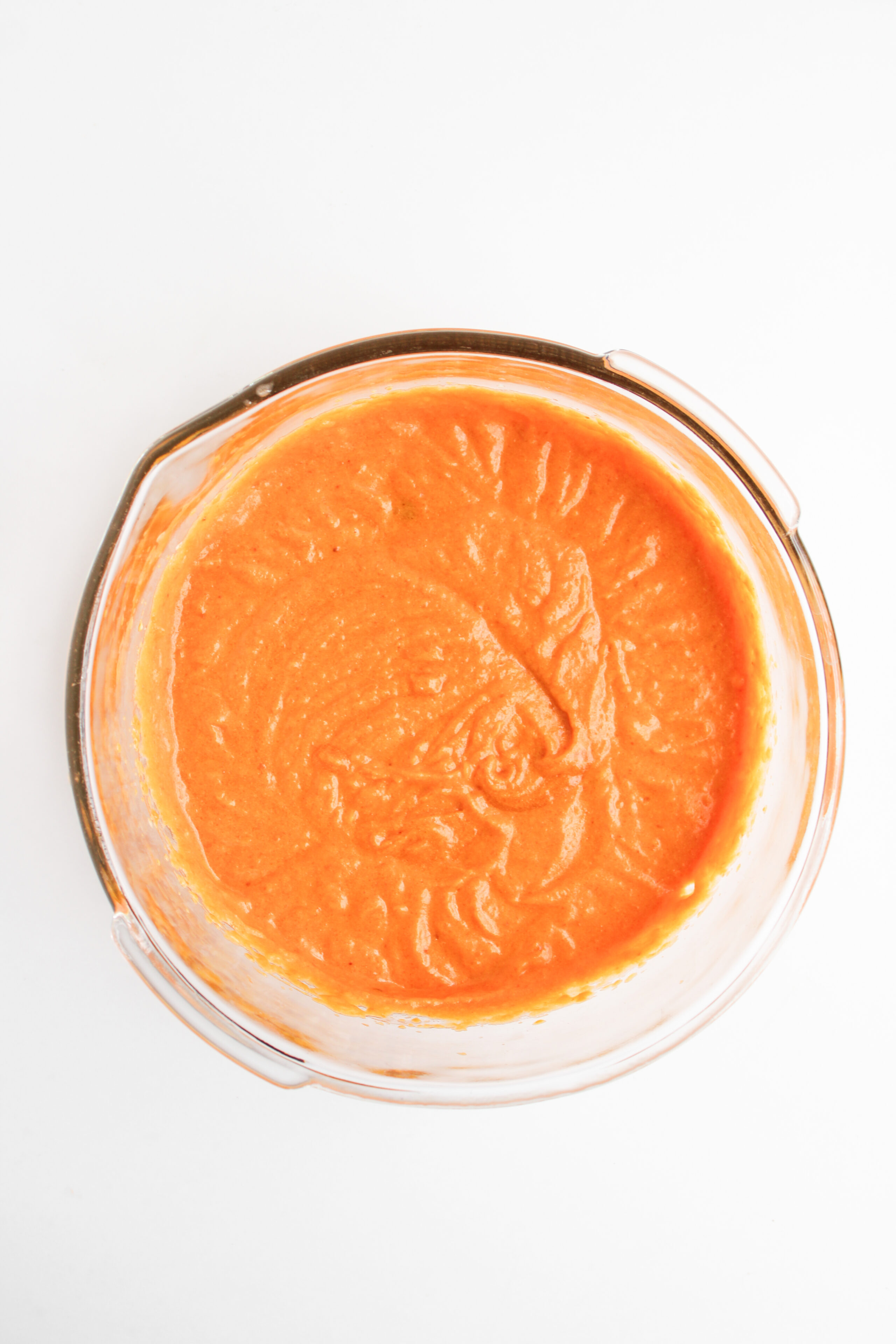 pumpkin spice muffin batter in a glass bowl.