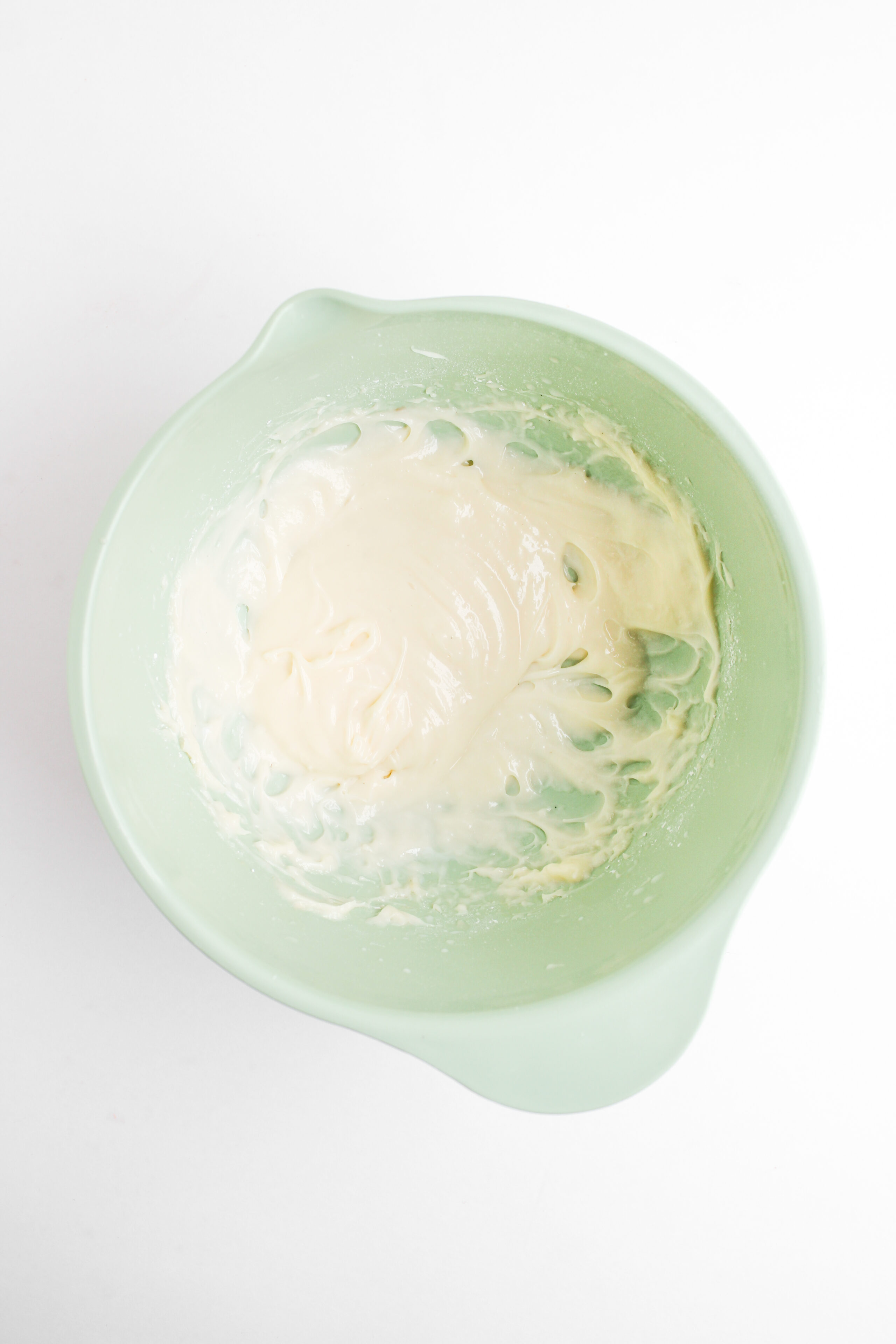 cream cheese frosting made in a bowl.