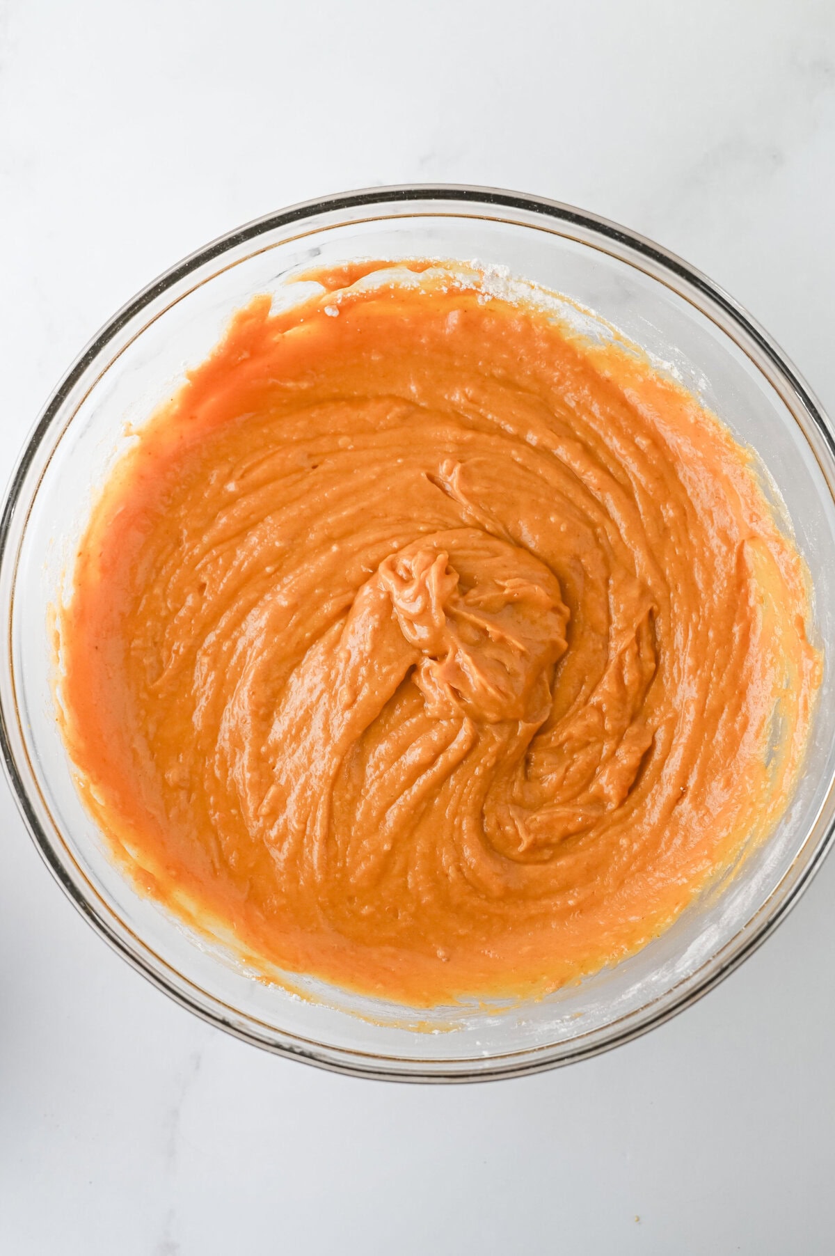 dry ingredients whisked into pumpkin muffin batter.