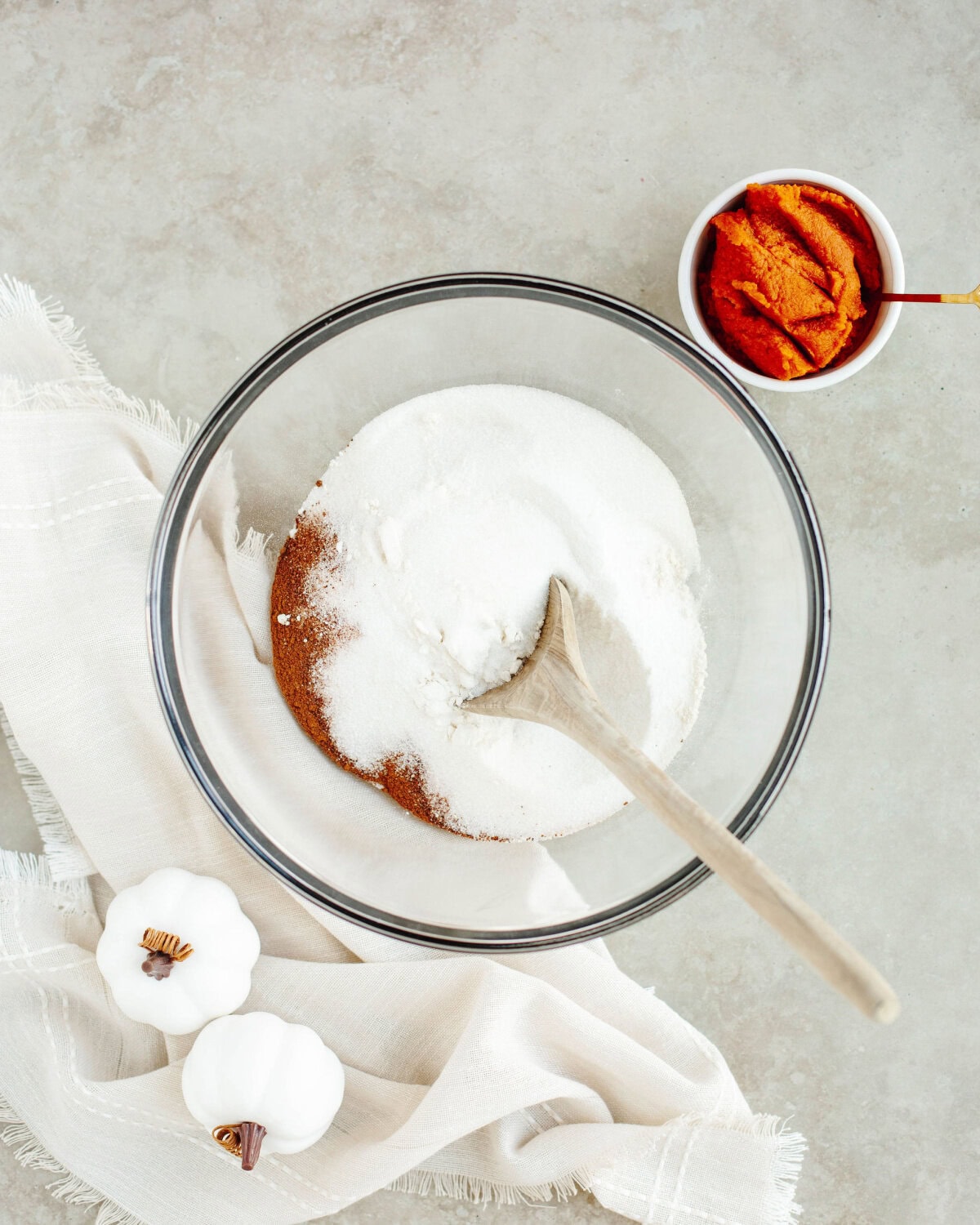 dry ingredients added to a glass mixing bowl.