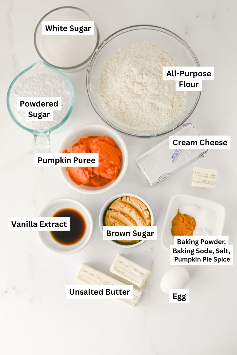 all the ingredients needed to make pumpkin cookies with cream cheese frosting.