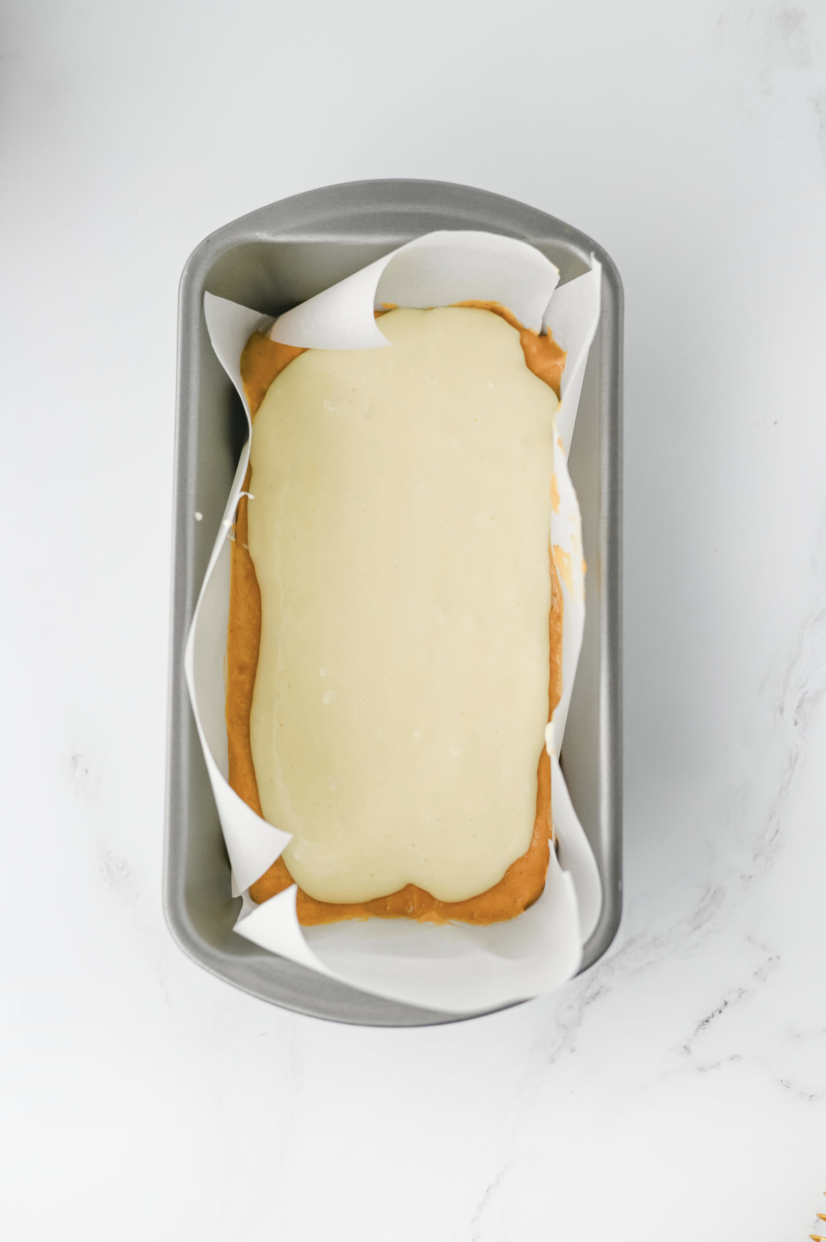 cream cheese filling spread in the middle of pumpkin batter.