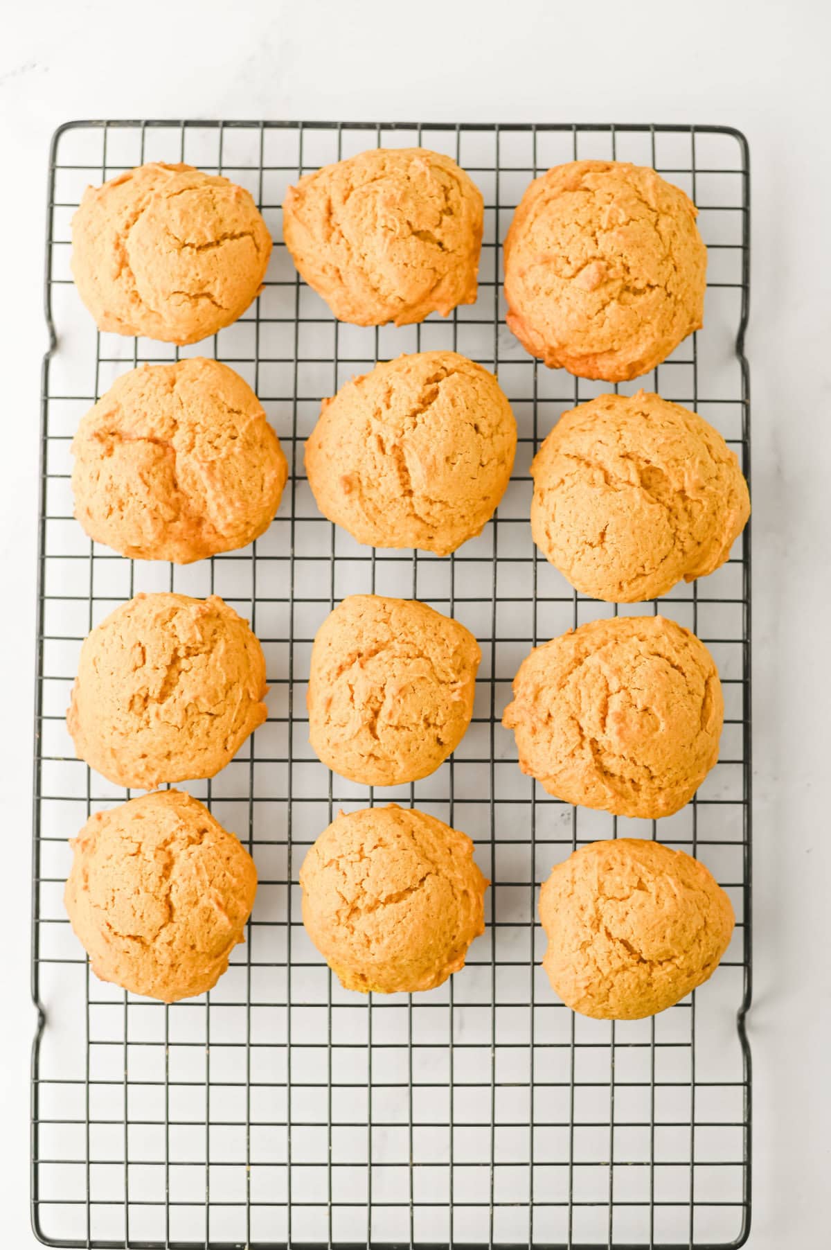 baked pumpkin cookies on a wire rack.