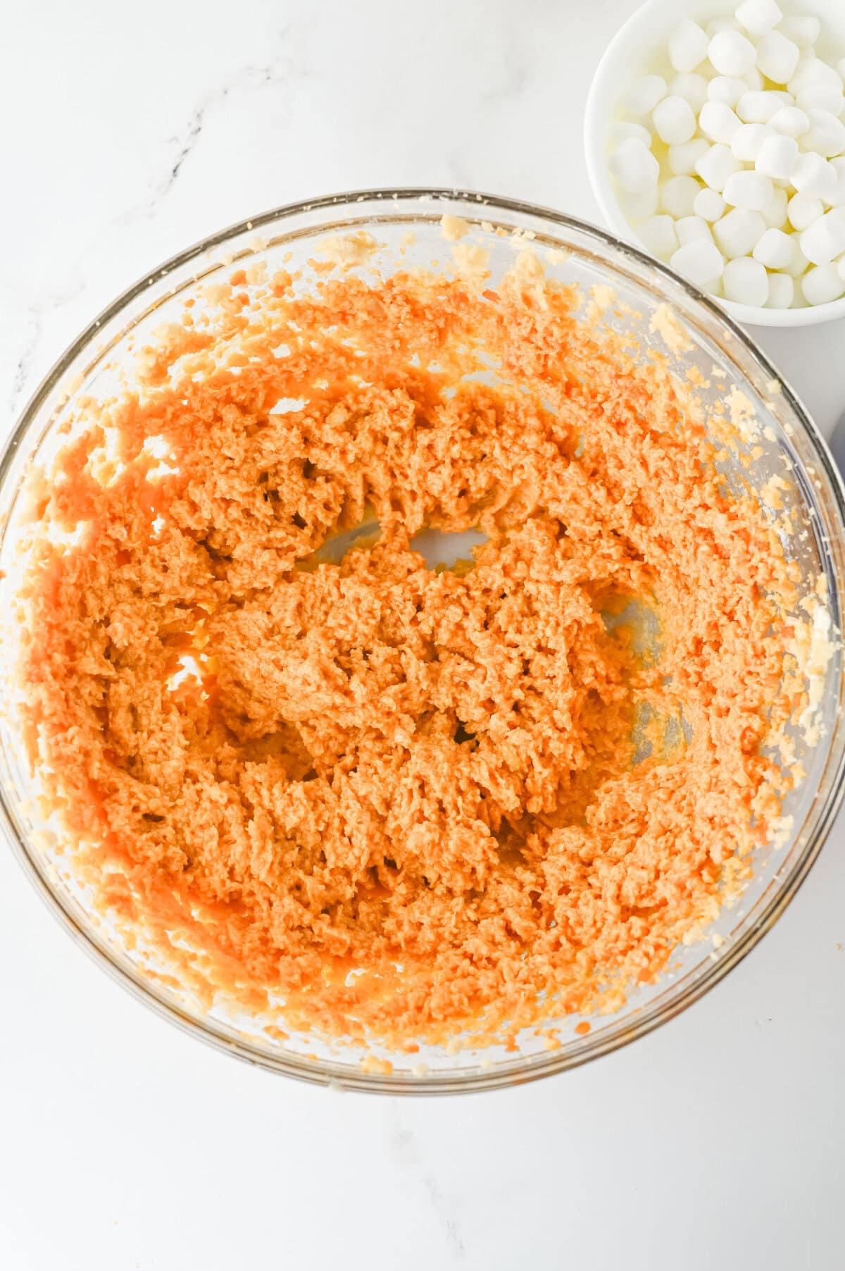 wet ingredients combined for pumpkin smores cookies in a glass mixing bowl.
