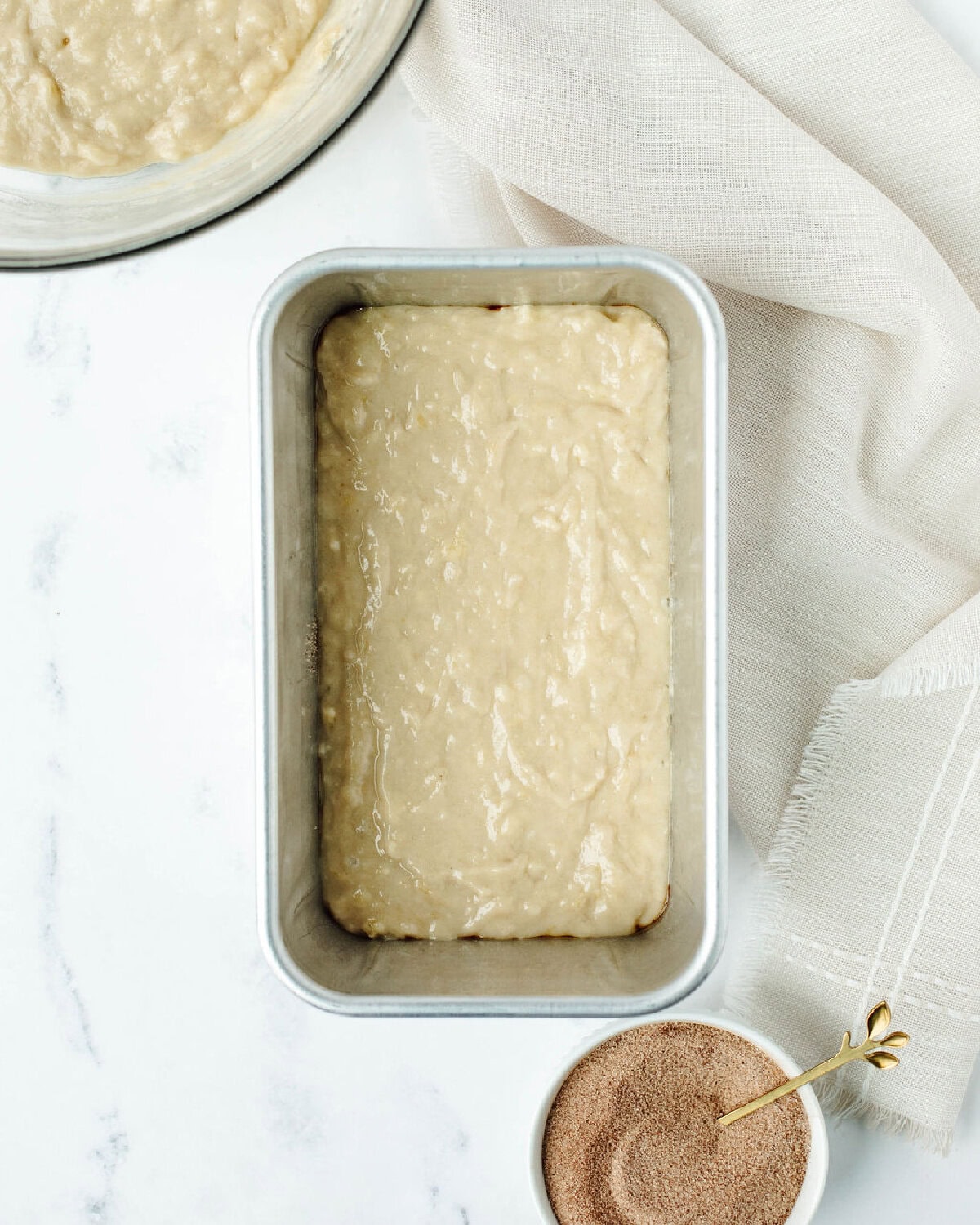 quick bread batter poured into a prepared loaf pan.