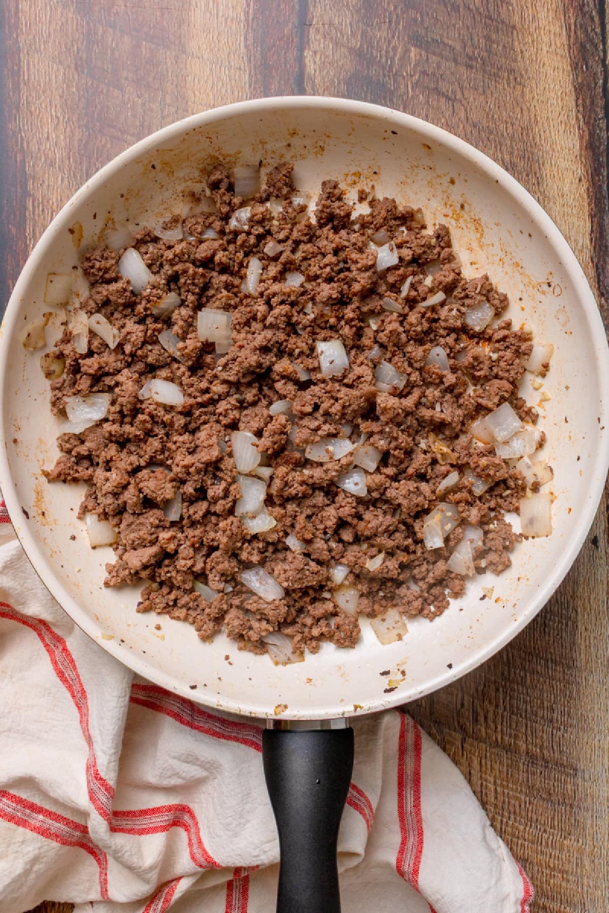 ground beef and onion cooked in a skillet until no longer pink.