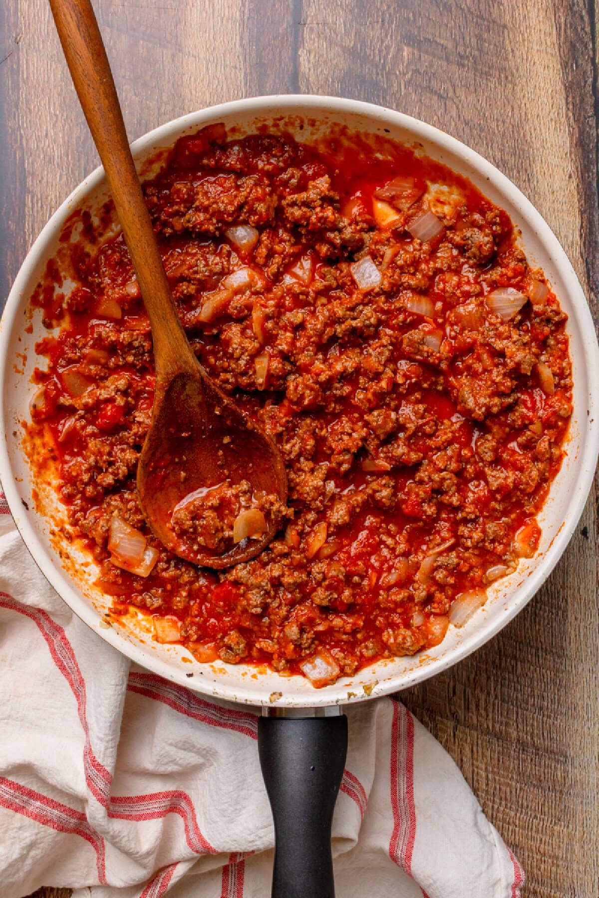 a spaghetti meat sauce simmering in a skillet.