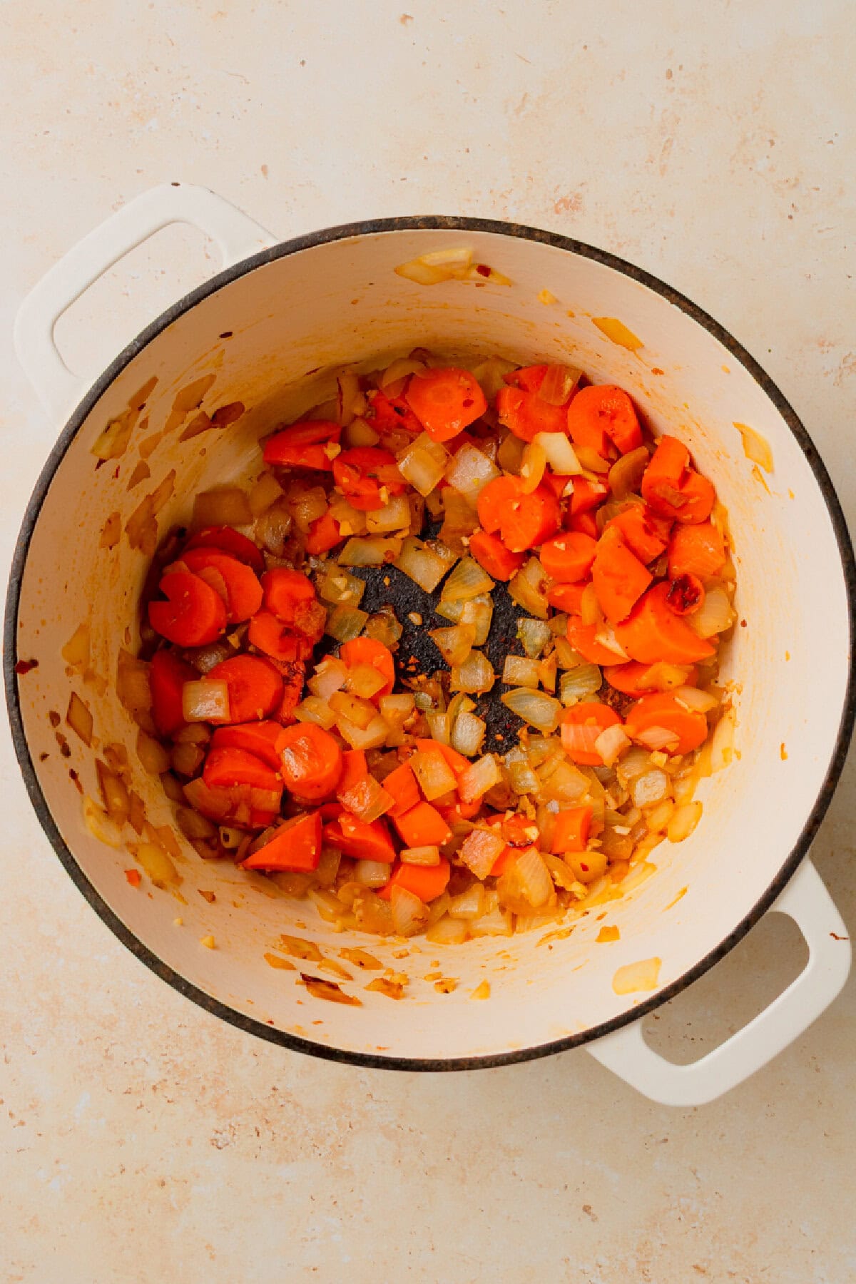 vegetables cooking in a large pot until tender.