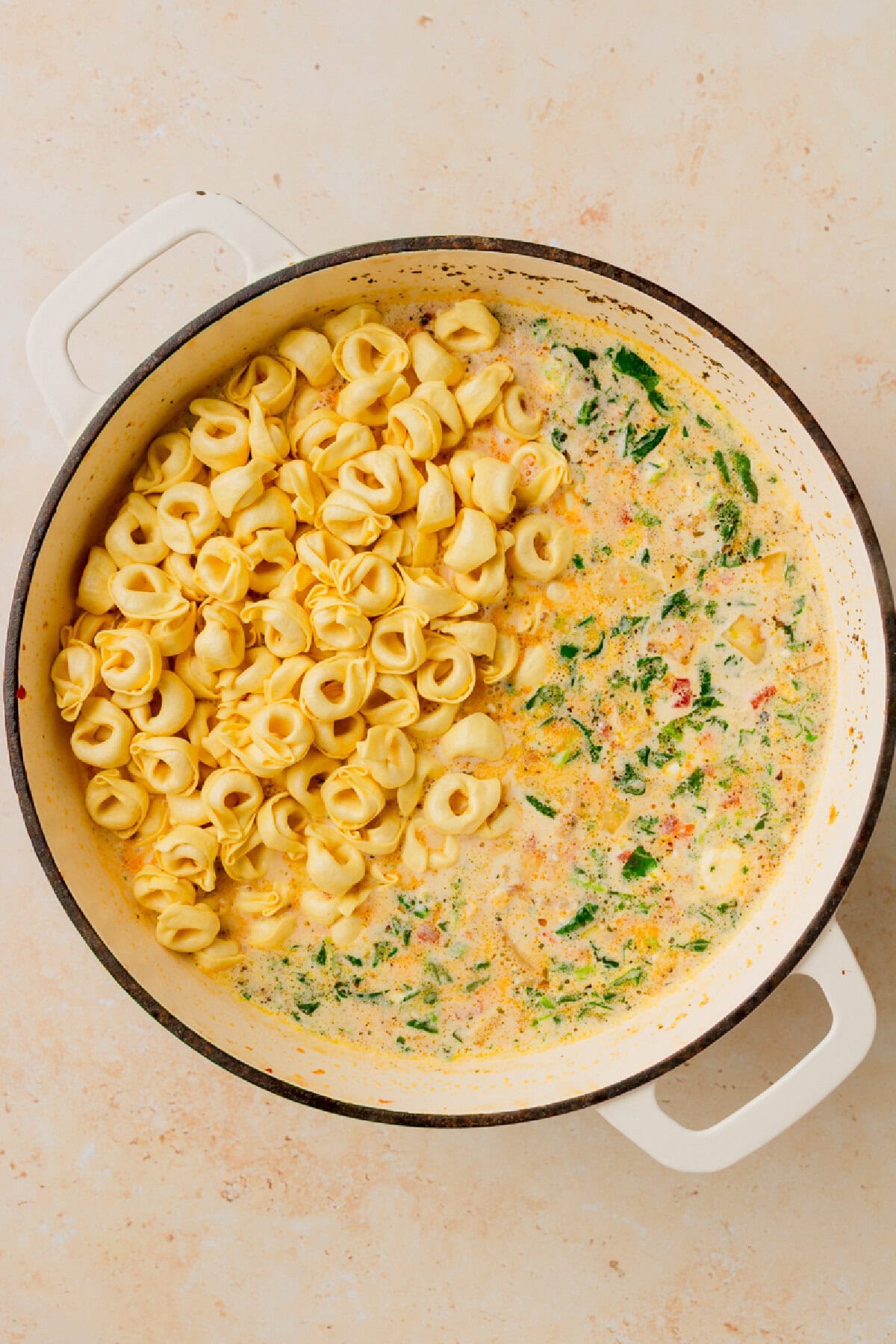 cheese tortellini added to a creamy soup.