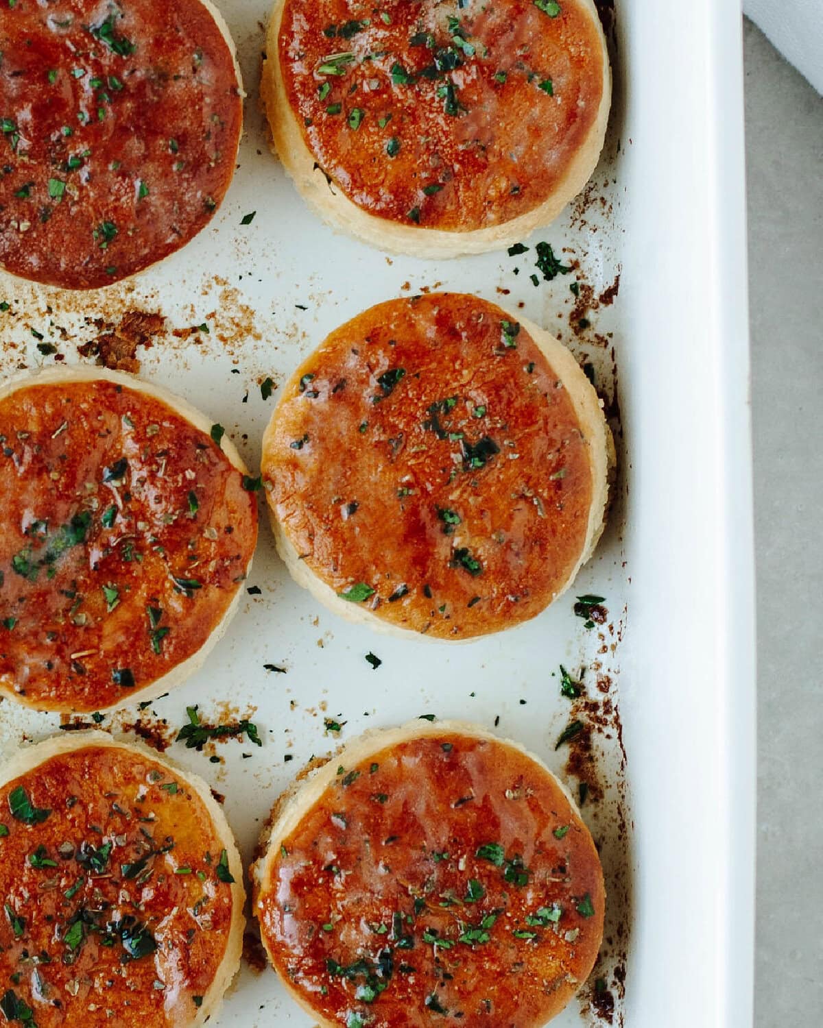 baked biscuits in a white baking dish.