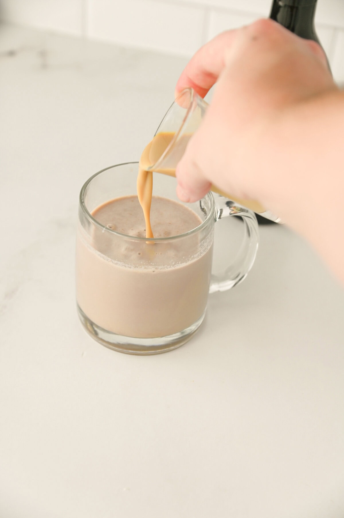 Bailey's Irish Cream poured into creamy hot chocolate.