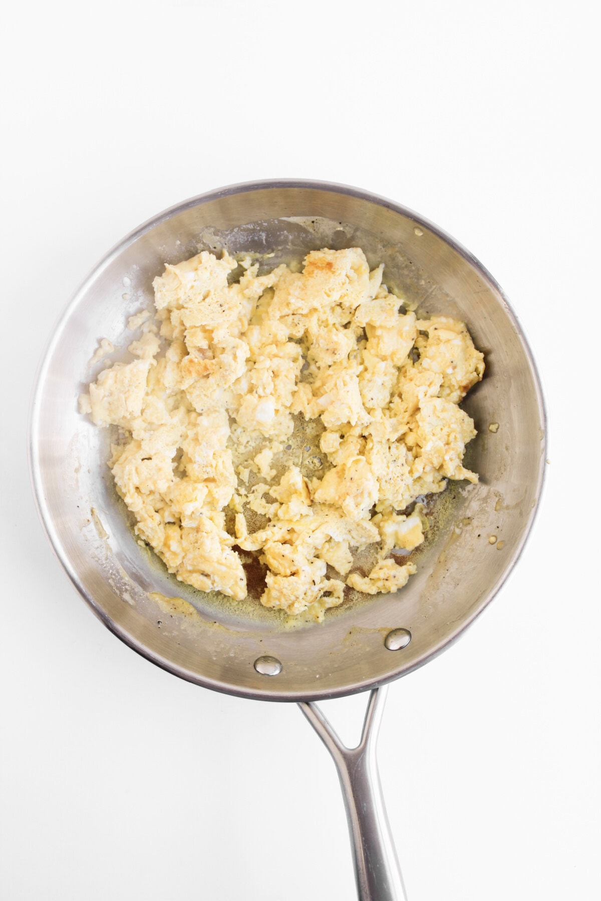 scrambled eggs in a skillet.