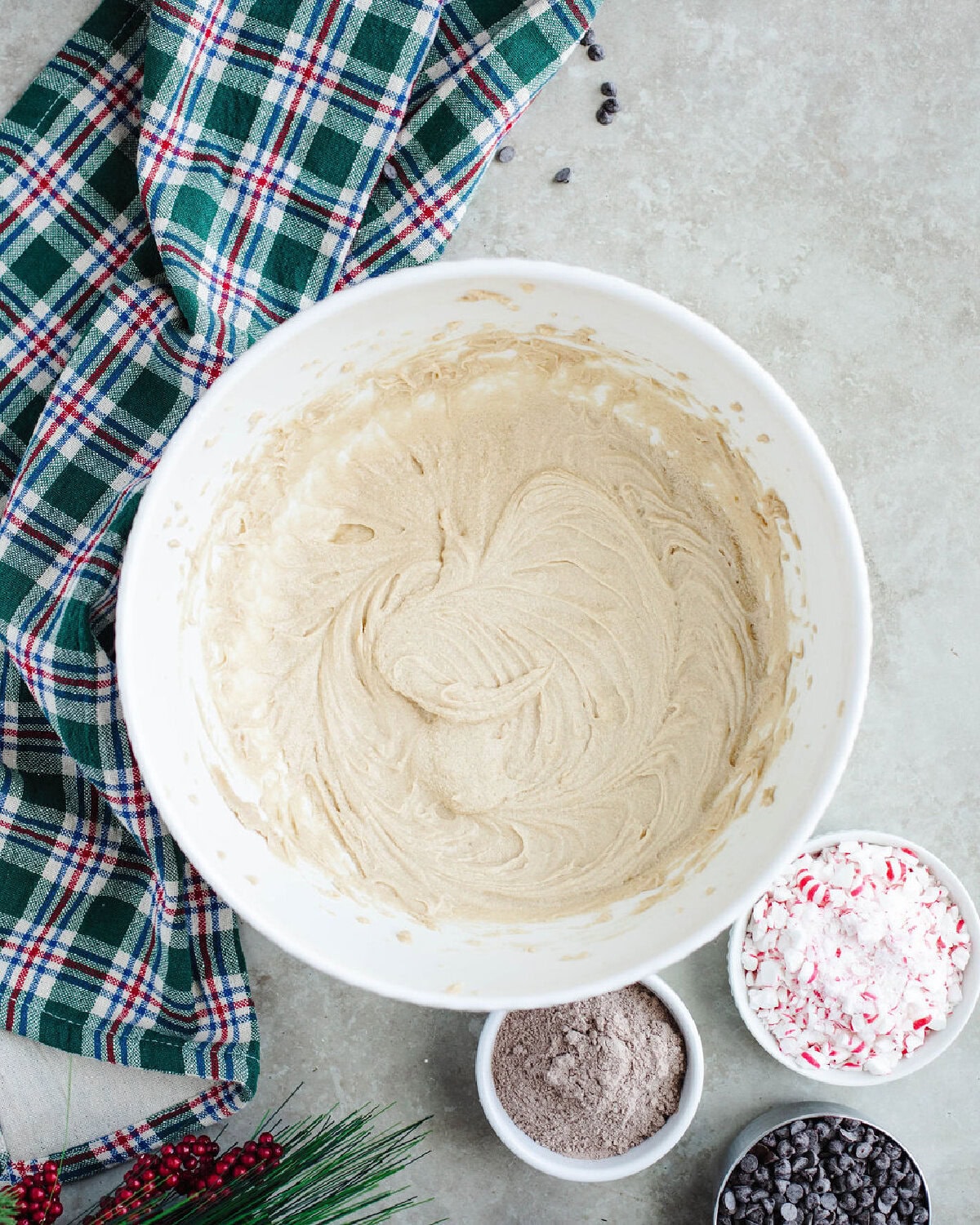 creamed butter and sugars combined in a mixing bowl.