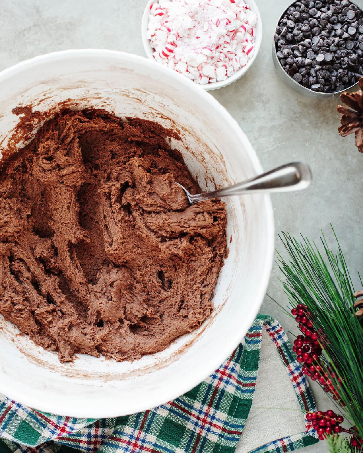 chocolate pudding mix added into cookie dough in a mixing bowl.
