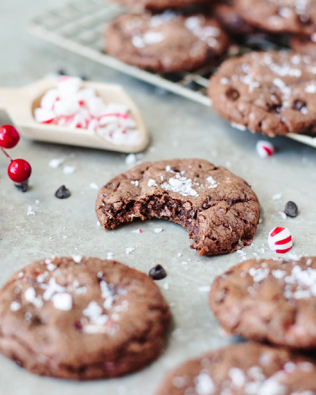 chocolate chunk peppermint pudding cookies with a bite taken out to show the center.