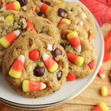 baked and ready to enjoy Fall Harvest Cookies on a stack of white plates.