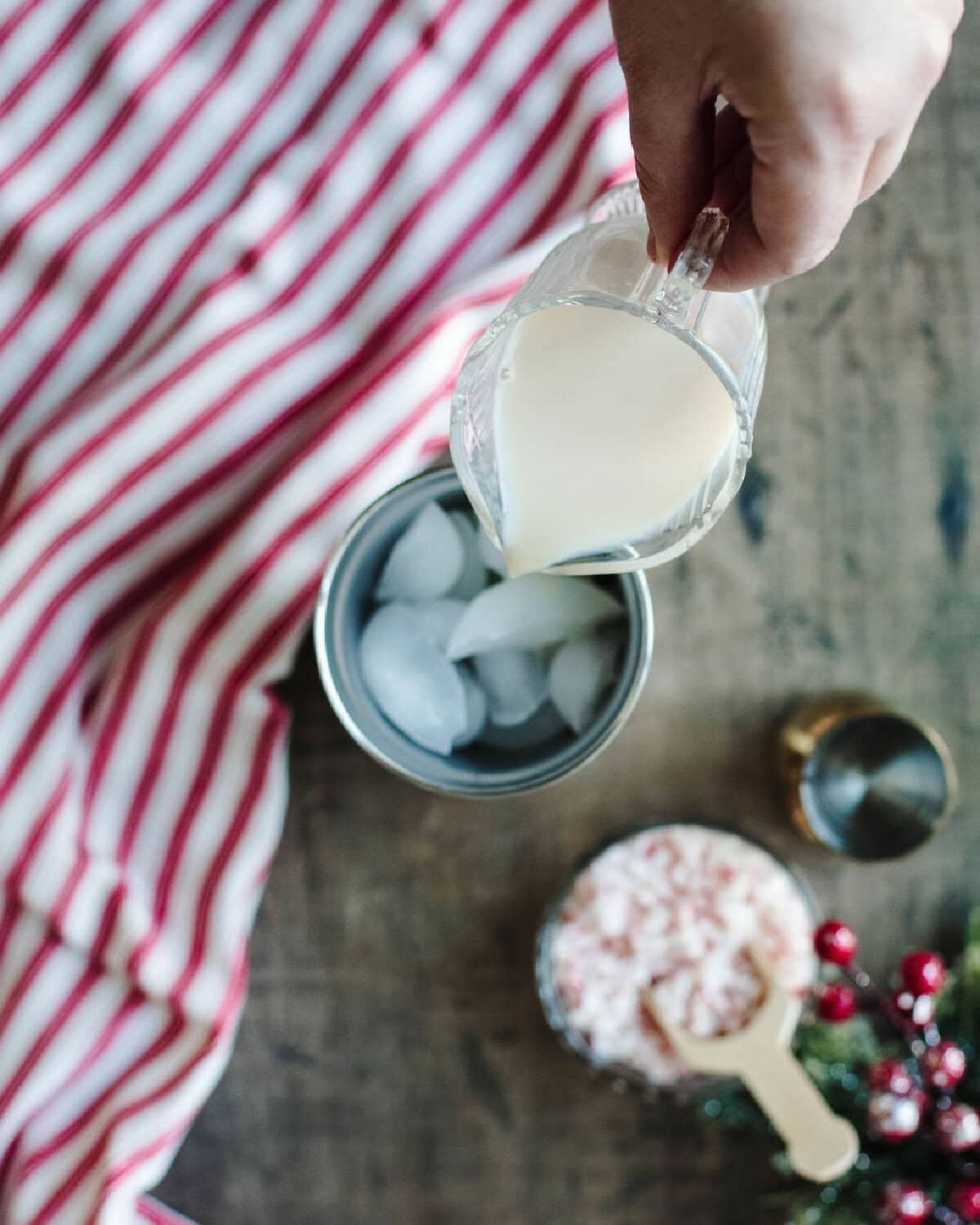 RumChata poured into an ice filled cocktail shaker.