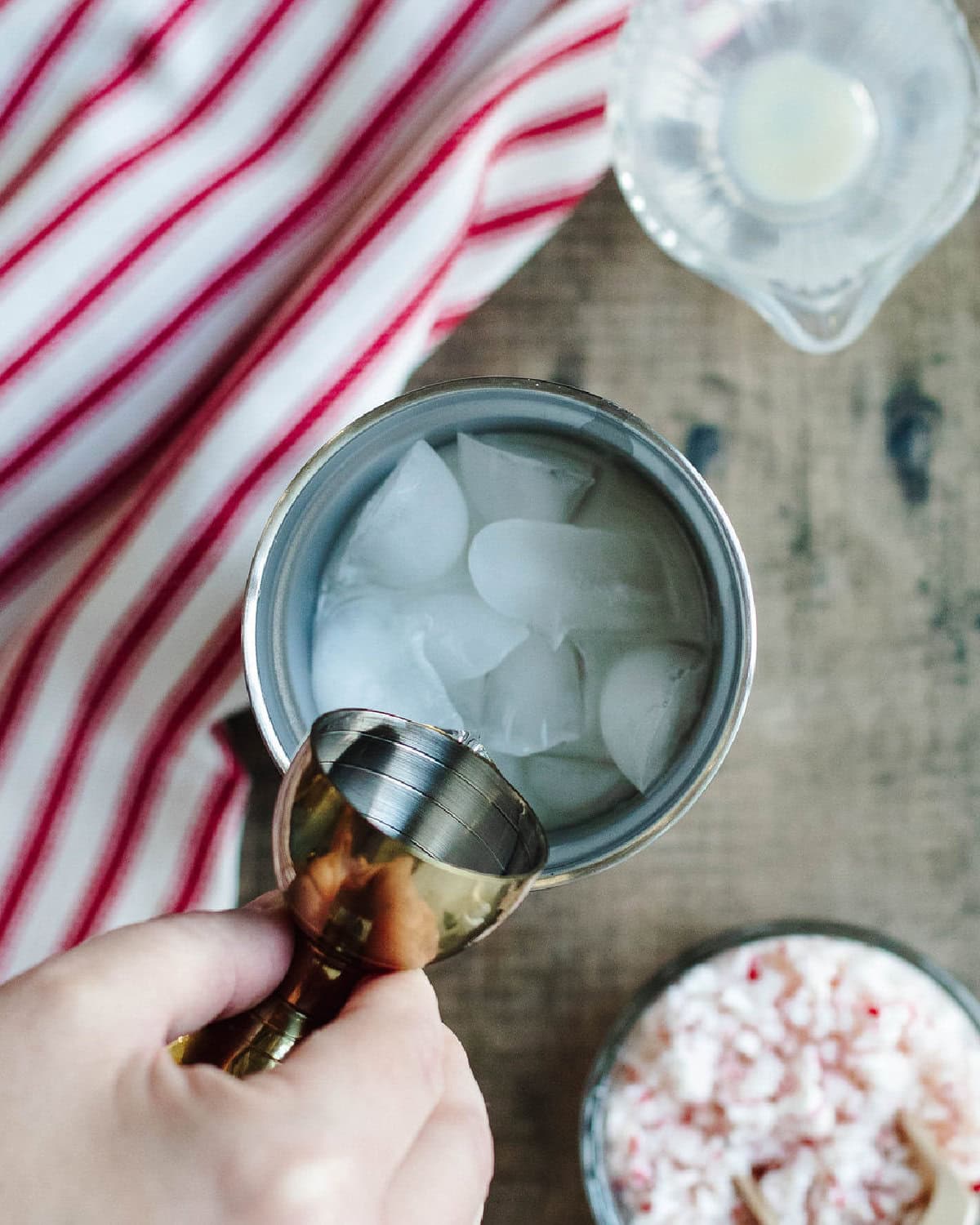 Peppermint Schnapps added to a cocktail shaker with RumChata.
