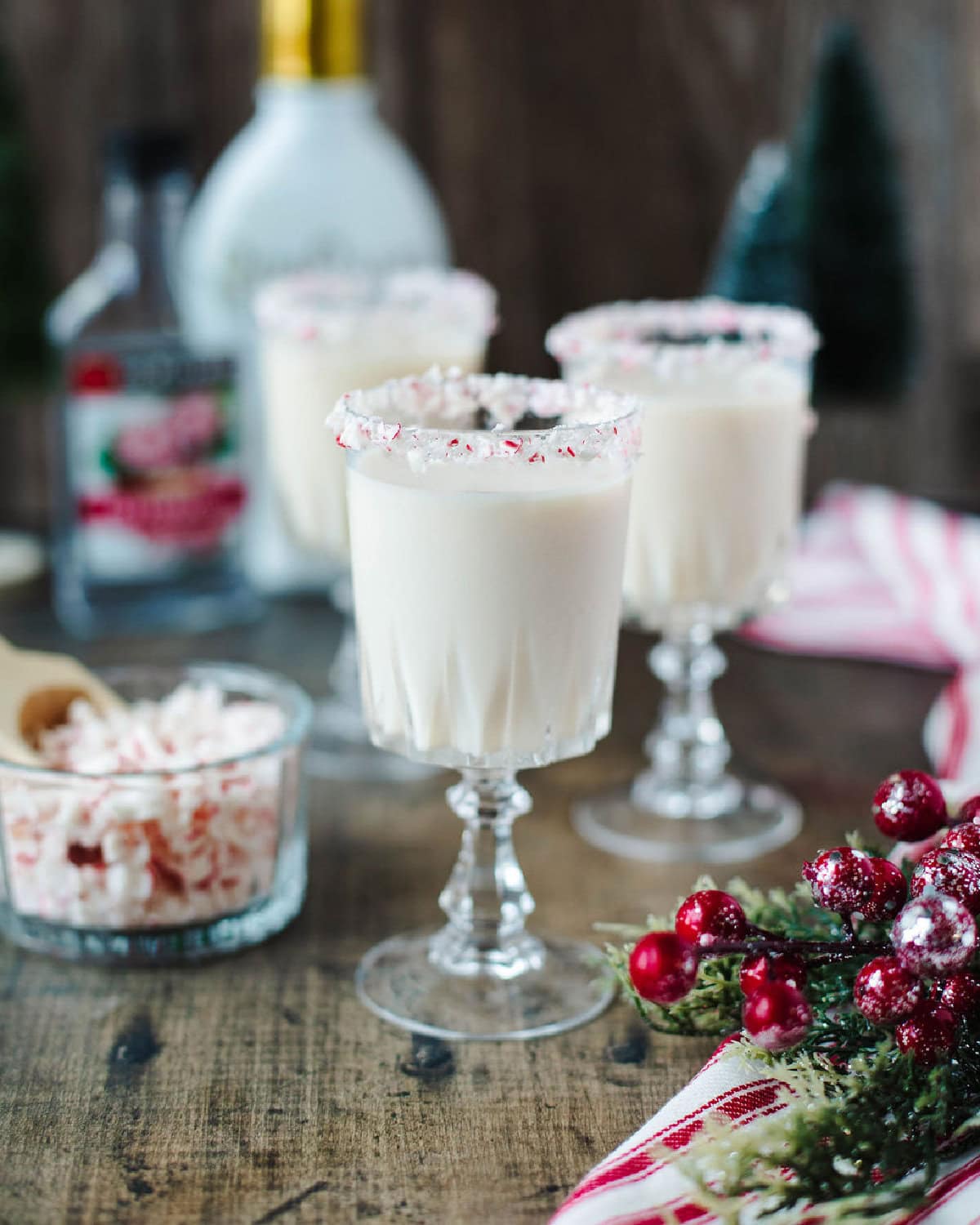 a two ingredient creamy cocktail in candy cane rimmed glasses.