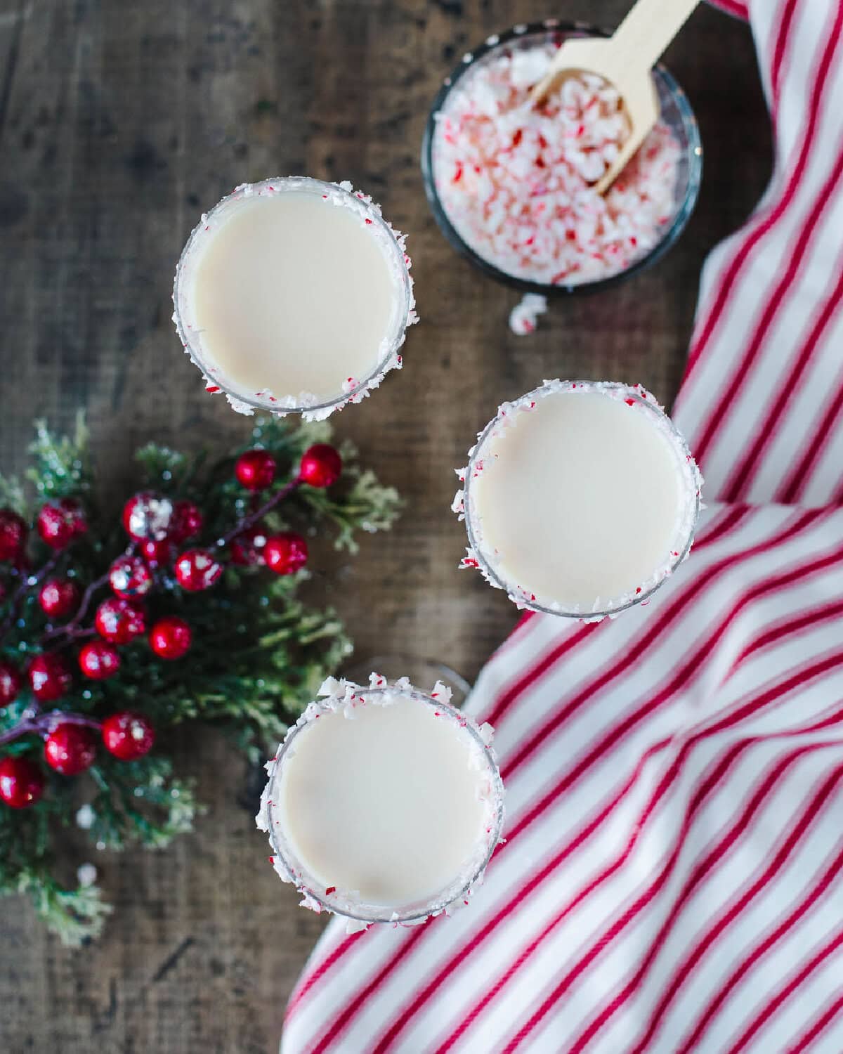 a top view of two White Christmas martini's with candy cane.