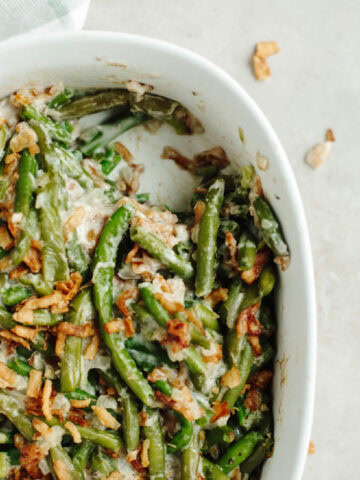 baked green bean casserole in a white baking dish.