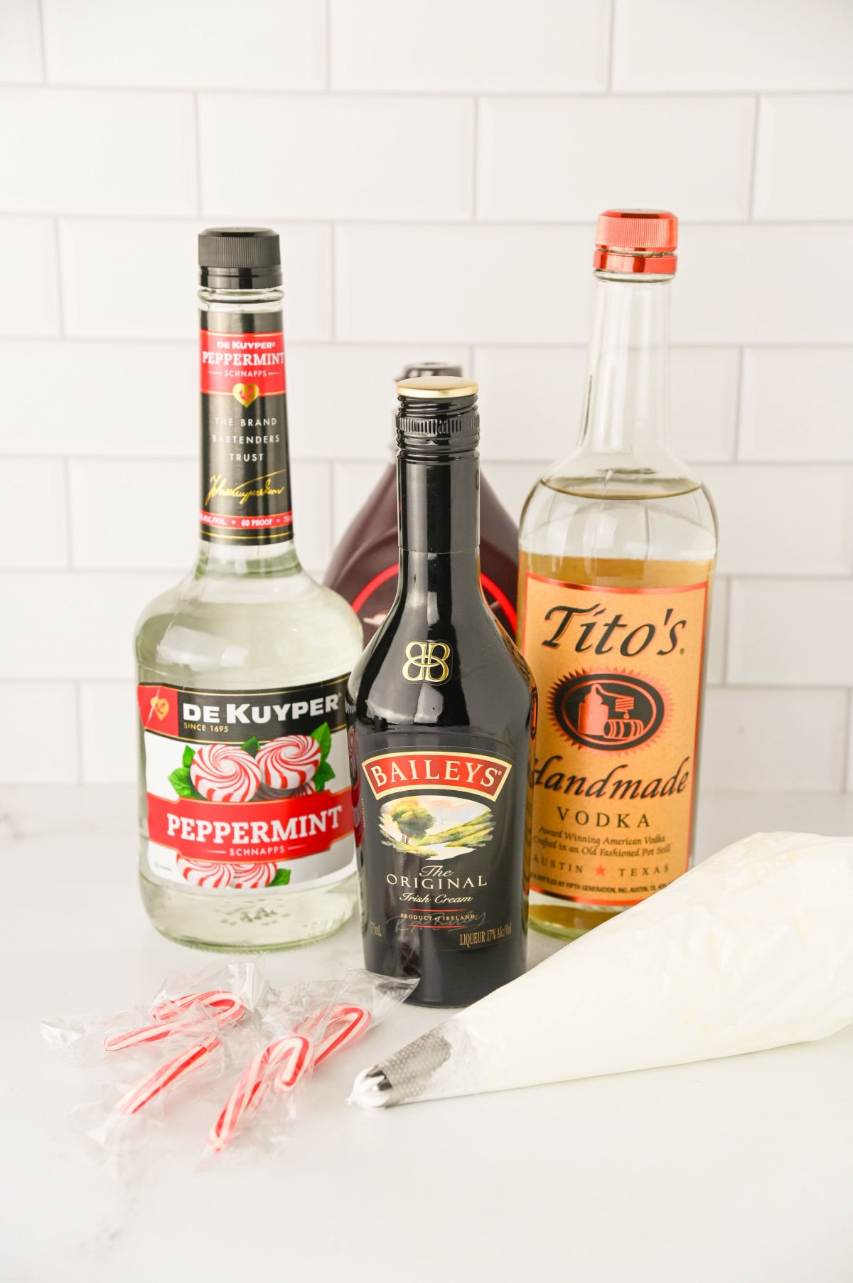all the ingredients needed to make a Bailey's Peppermint Martini.