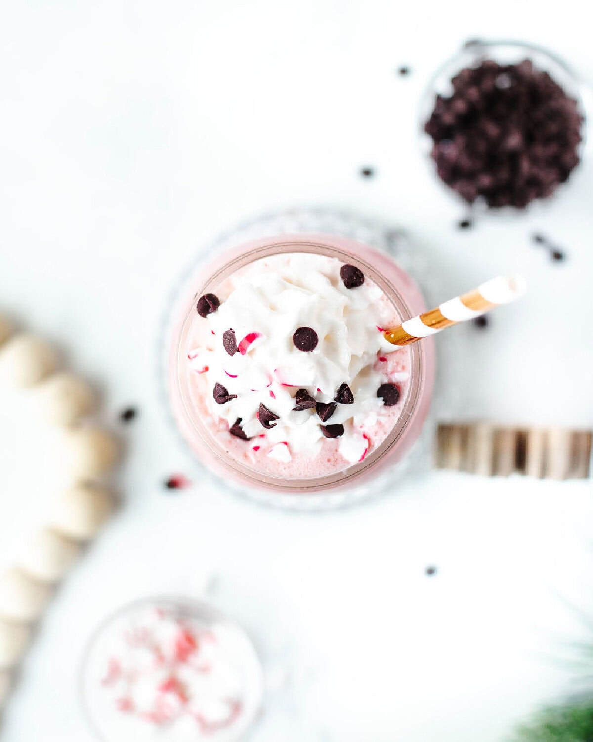 a top view of a peppermint milkshake with whipped cream on top.