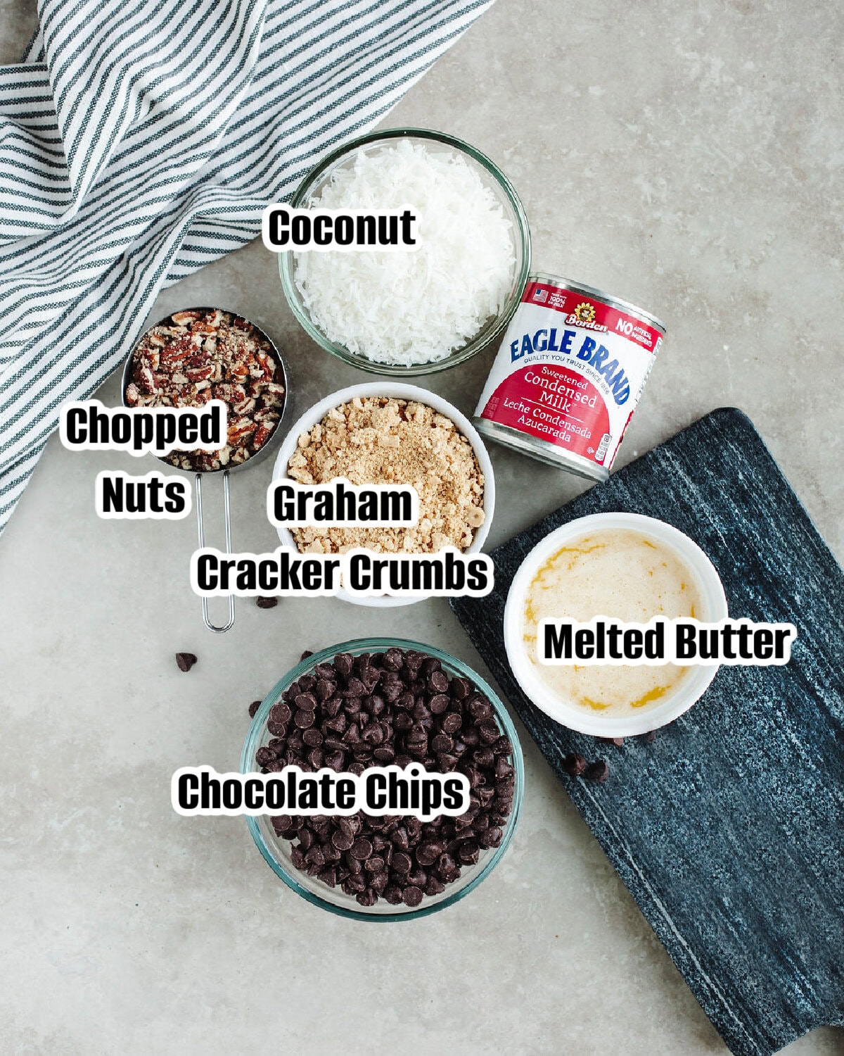 all the ingredients needed to make eagle brand magic cookie bars.