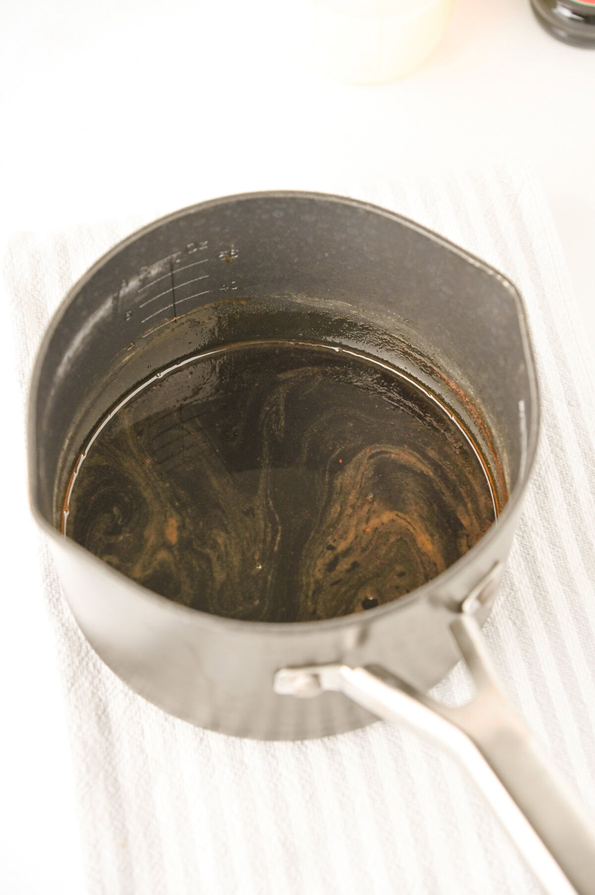 homemade gingerbread syrup made in a saucepan.