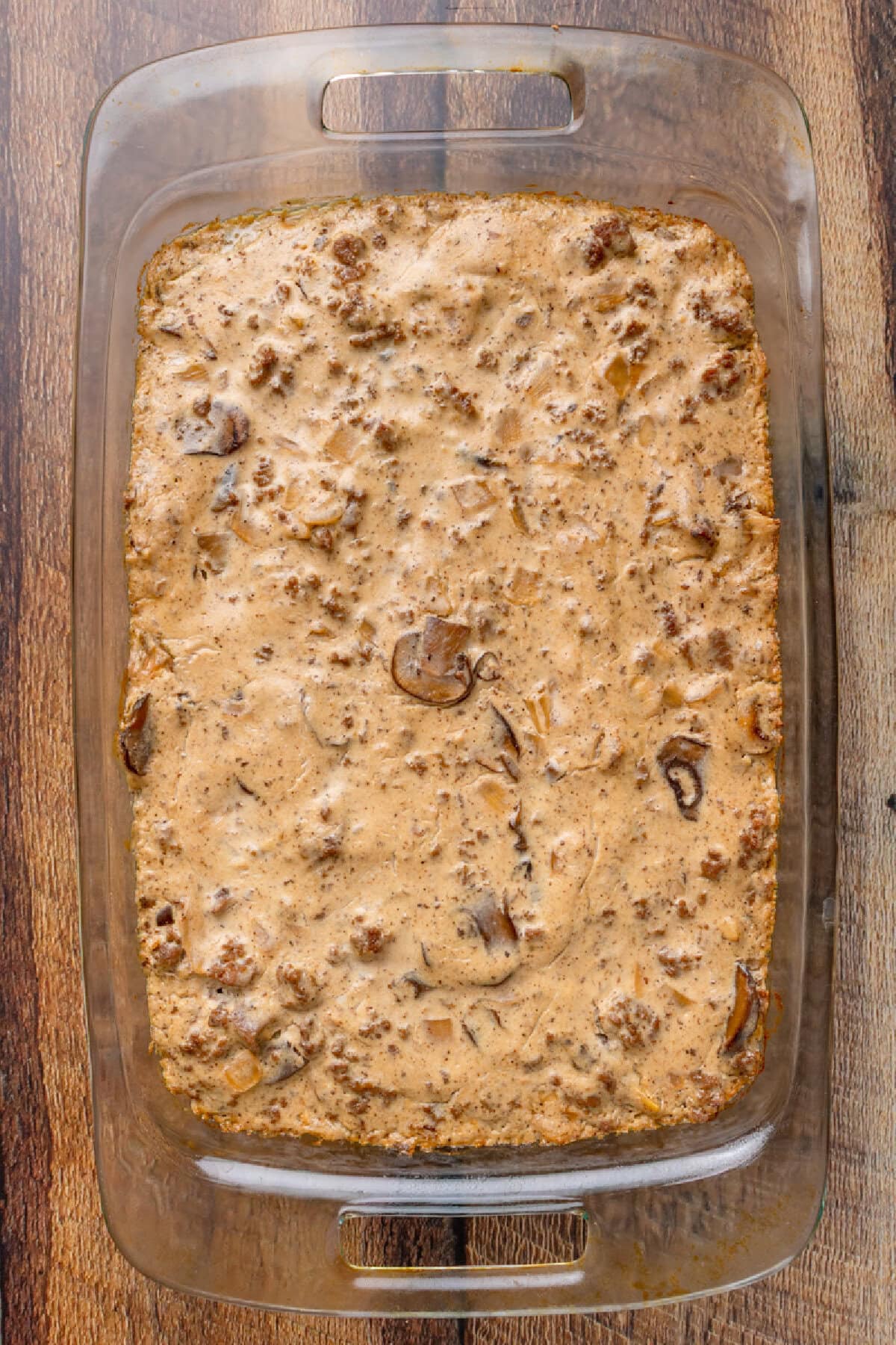 Creamy beef stroganoff casserole baked in a glass baking dish and ready to serve.