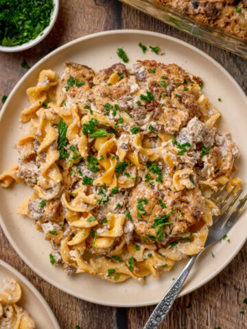 Beef stroganoff casserole served on a plate with a fork.