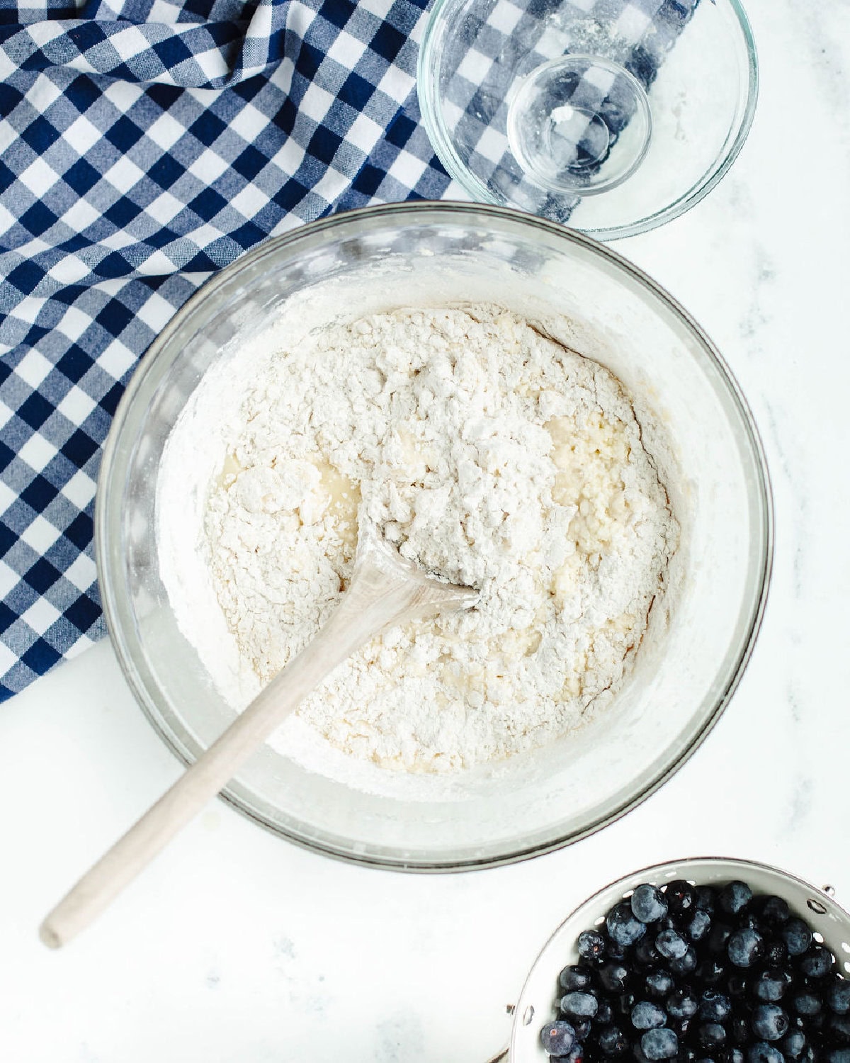 flour and dry ingredients folded into the creamed butter mixture in a mixing bowl.