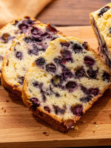 Easy homemade blueberry bread loaf sliced and ready to serve.