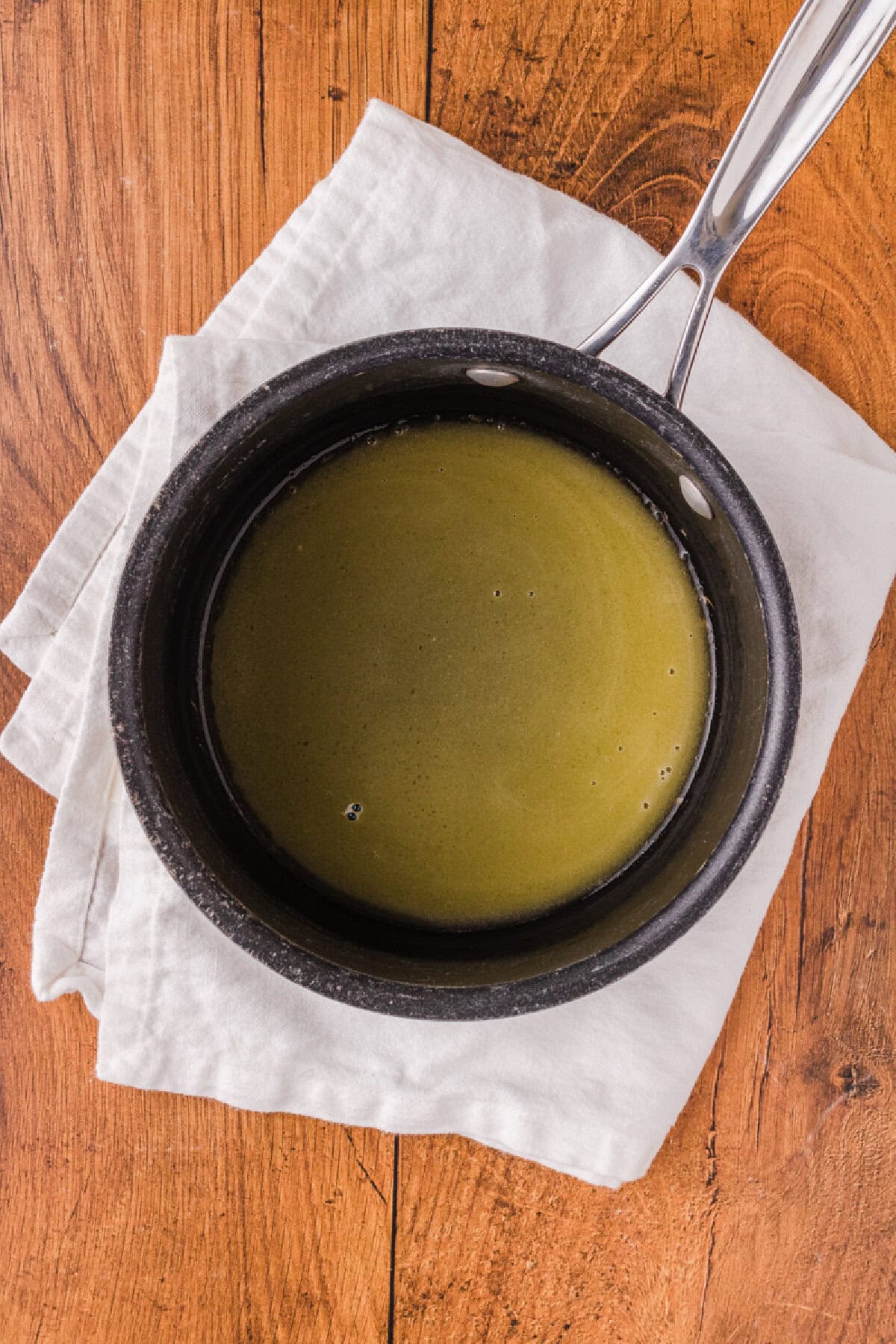 melted butter in a black saucepan.