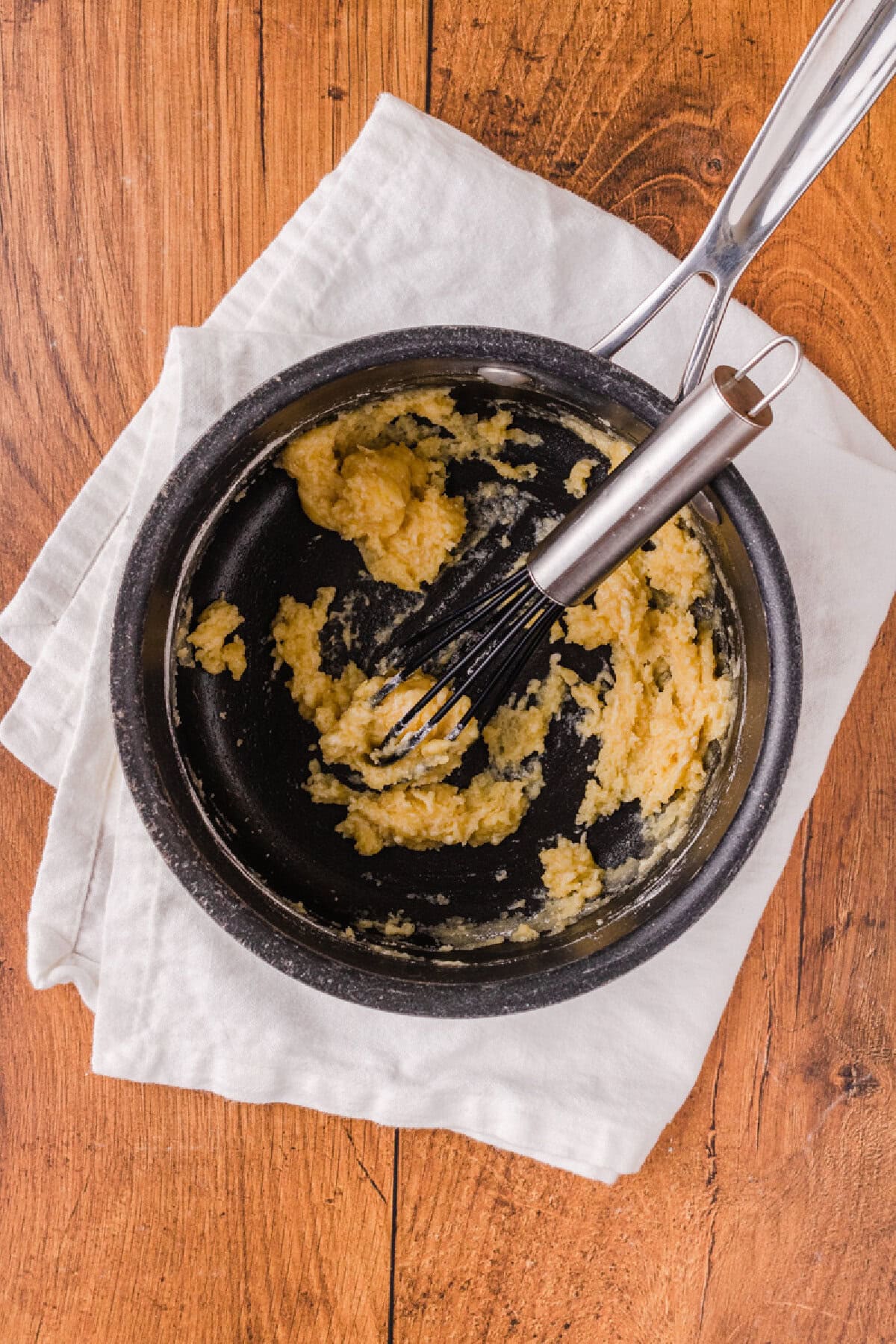 flour combined with melted butter to form a roux in a saucepan.